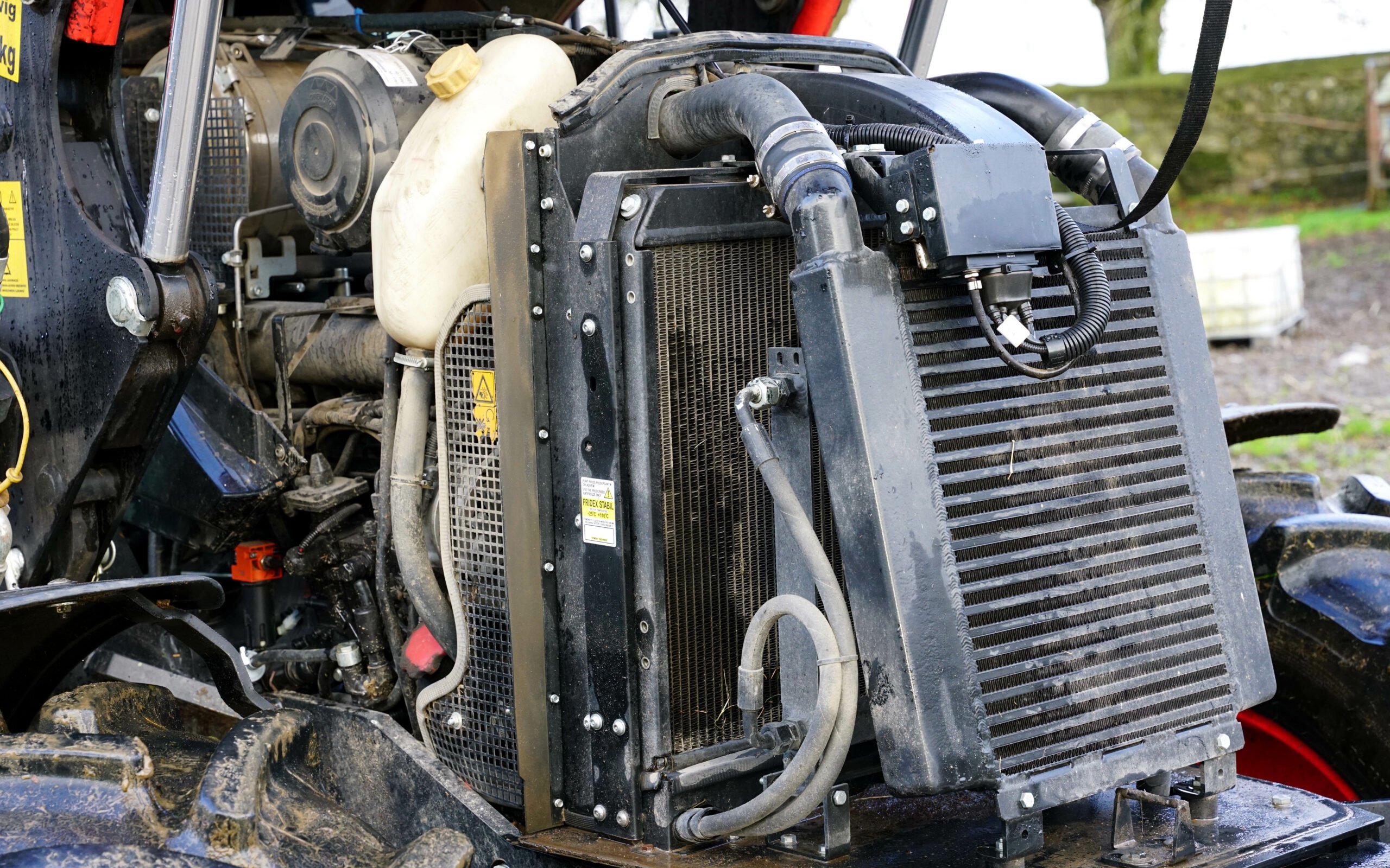Access to the engine is easy with plenty of room between the coolers and radiator for cleaning out