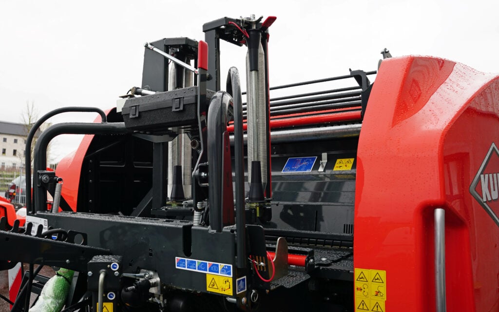 Twin applicators at the front of the machine apply the binding film layer