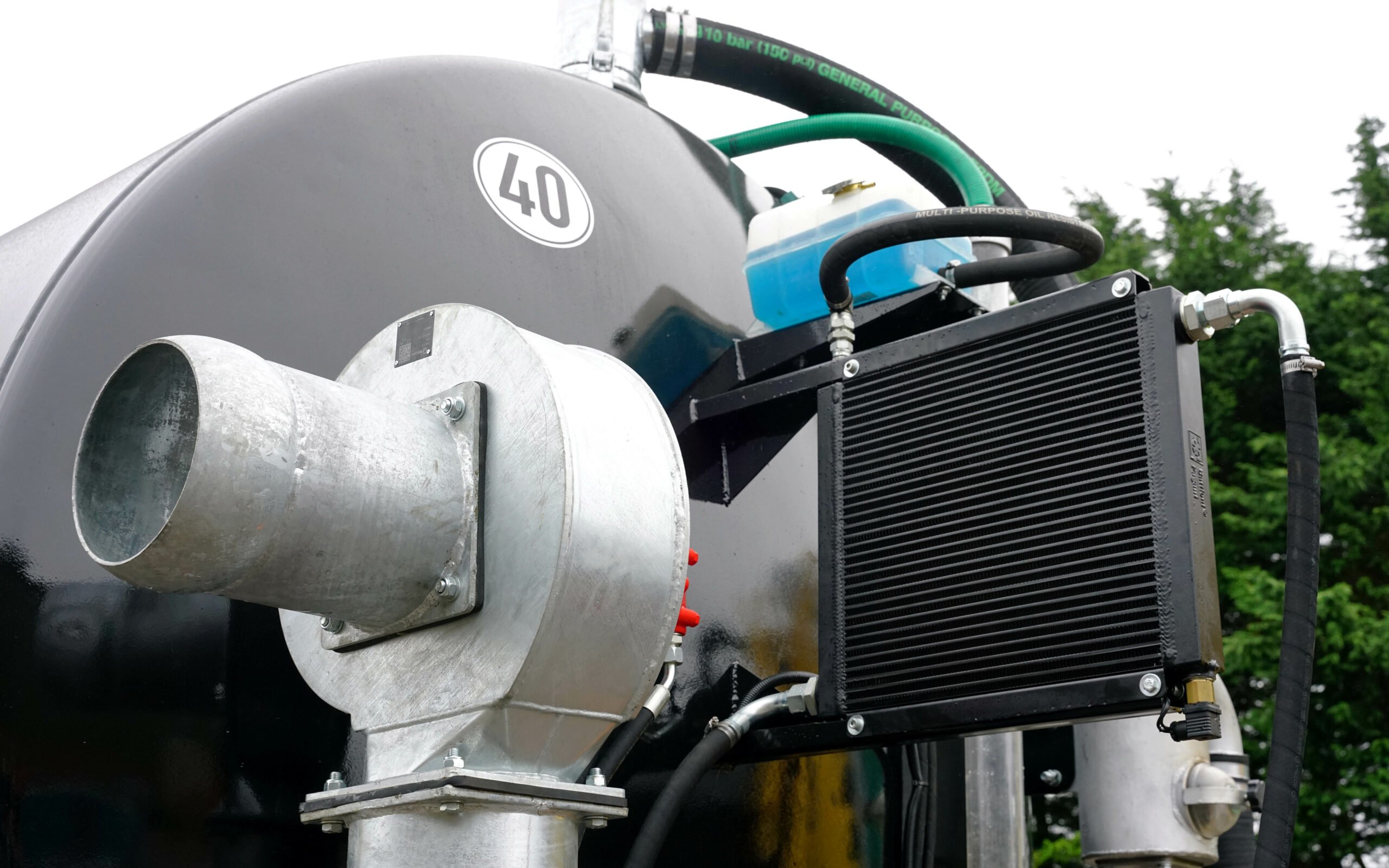 The high capacity vacuum pump requires added cooling while filling is aided by centrifugal pump on boom