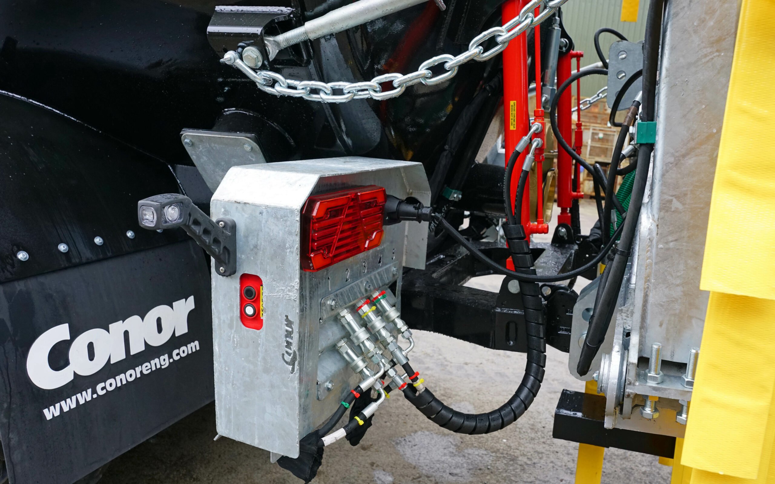 The boom mounts to a rear subframe to which a shallow disc cultivator can be fitted for incorporation if required