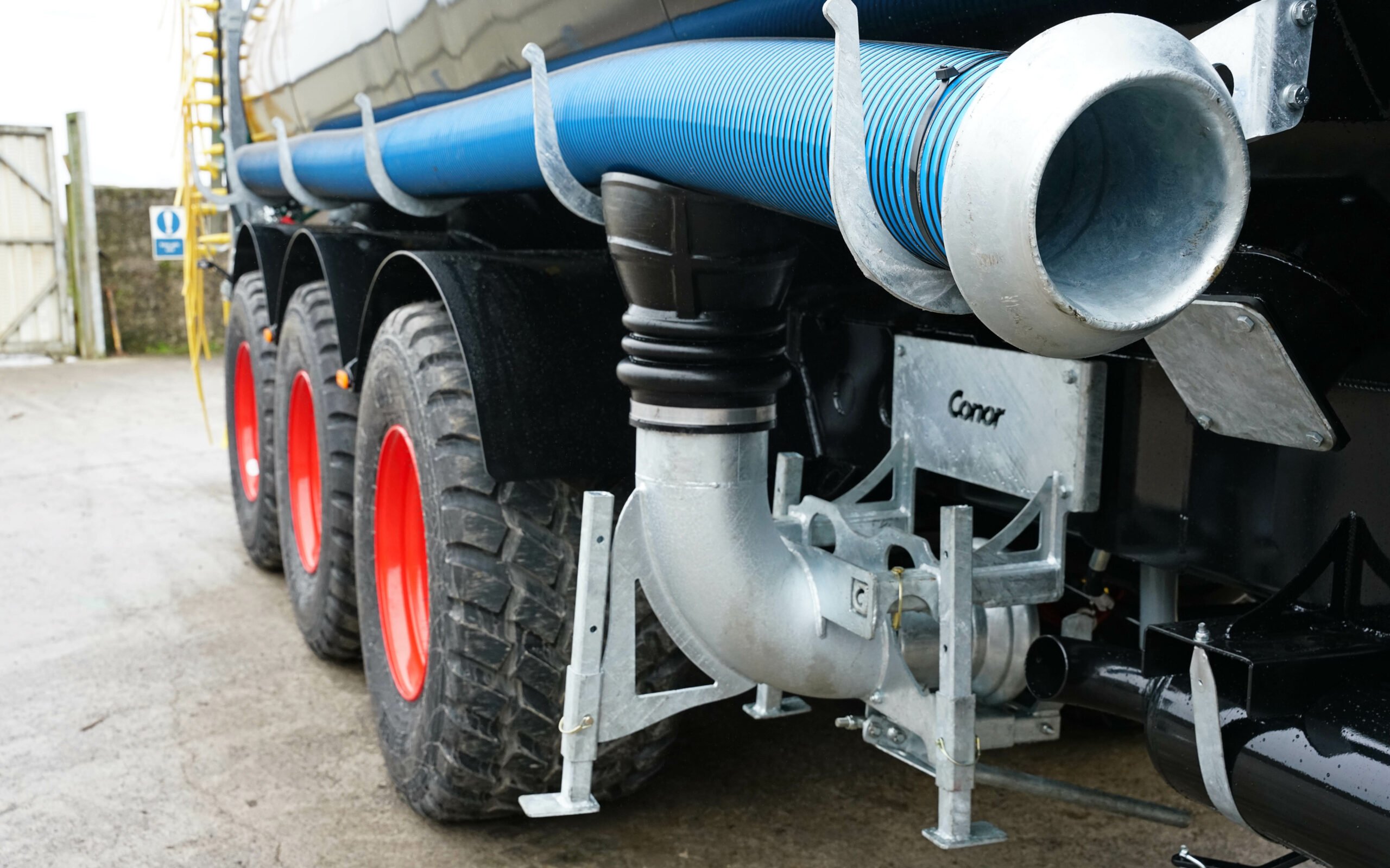 The ground hopper is carried under the tanker when not in use
