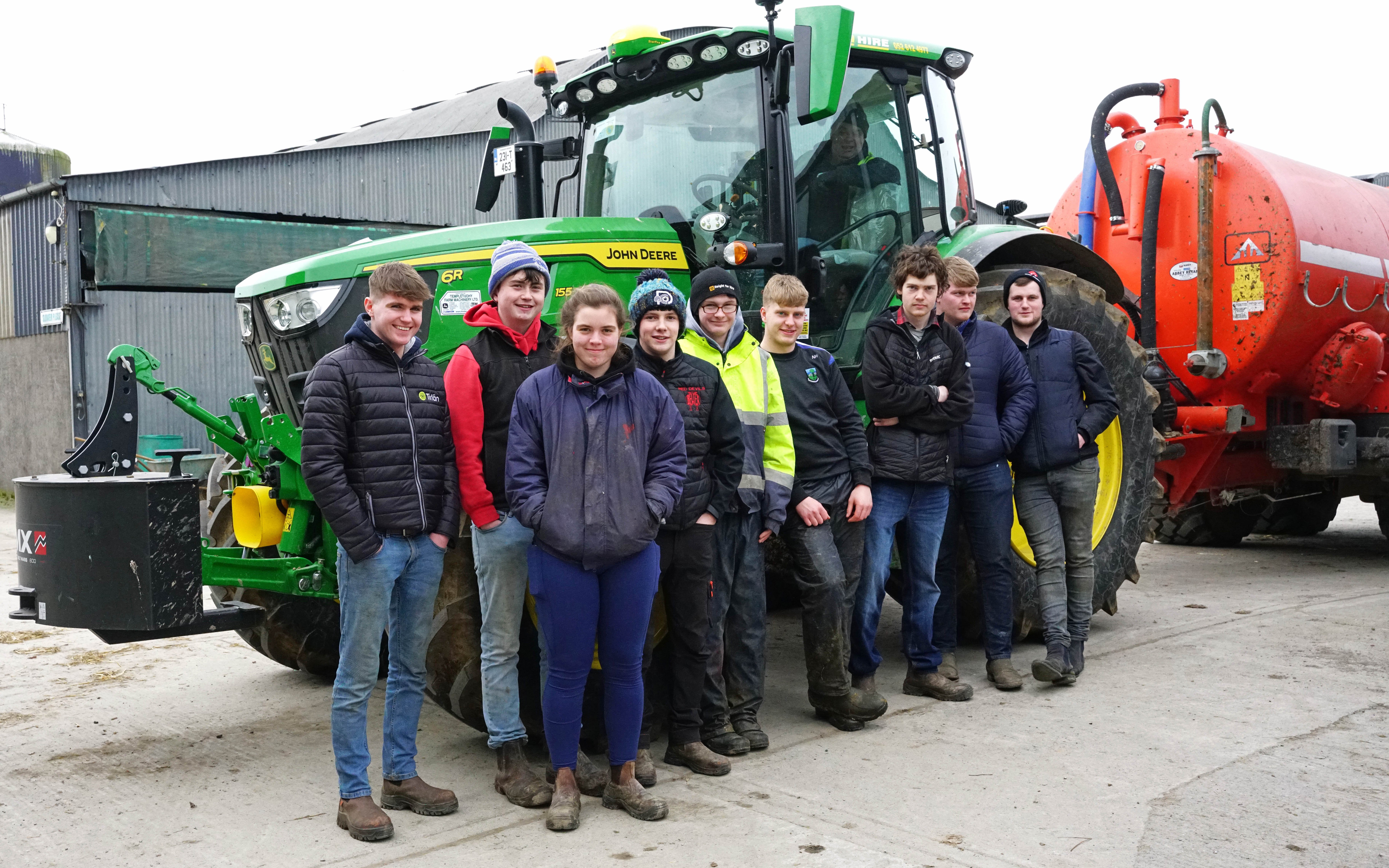 Gurteen College students of the level 5 course in agriculture await their turn on the JD 6R155