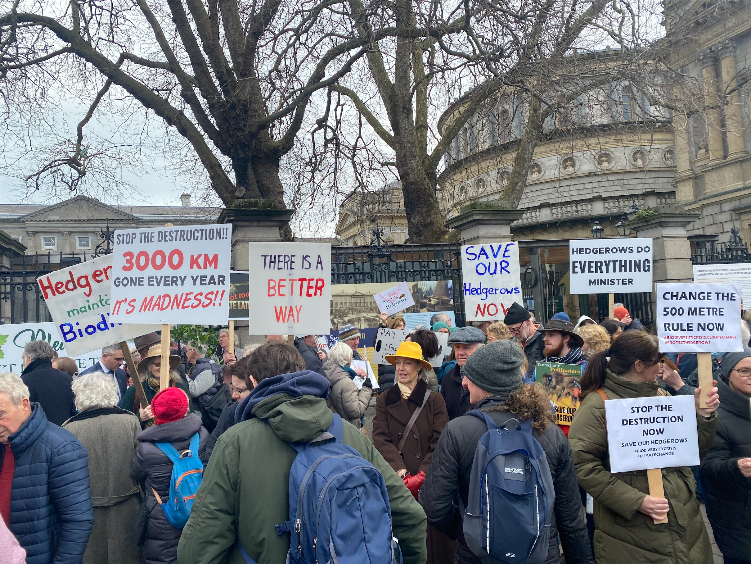 Protesters outside Leinster House demand a reduction of the 500 metre limit