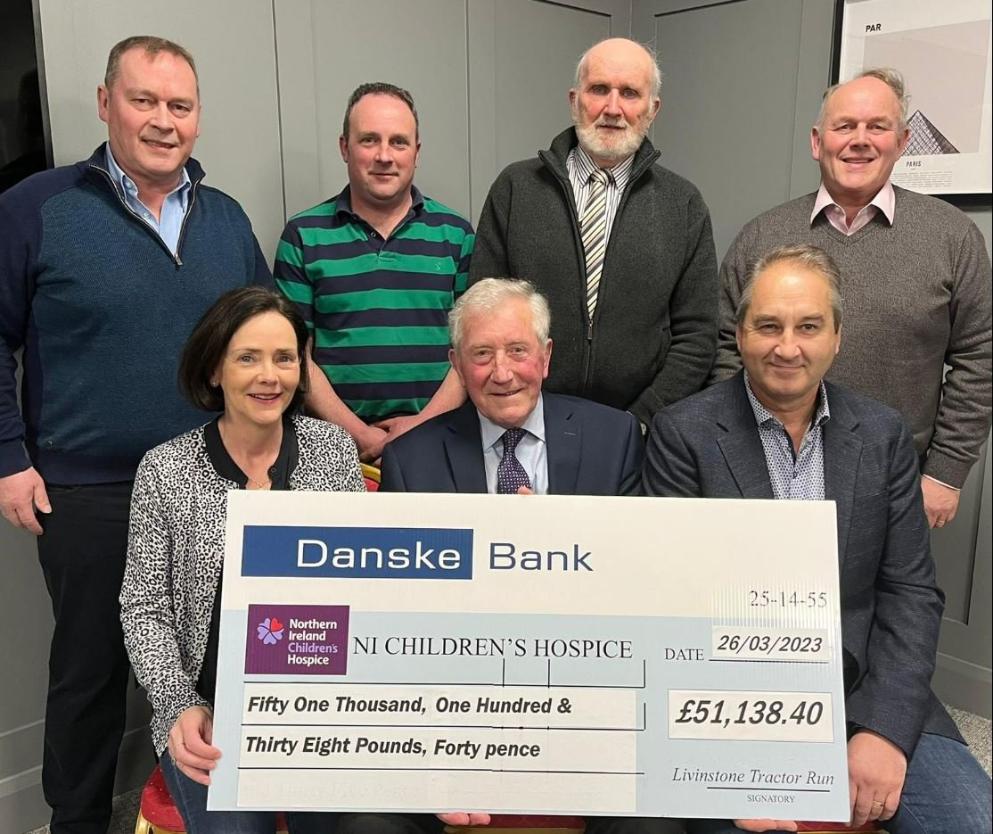NI Children's Hospice team and event organisers with the organisation's check from the tractor run. Image: Livingstone Christmas Tractor Run Facebook