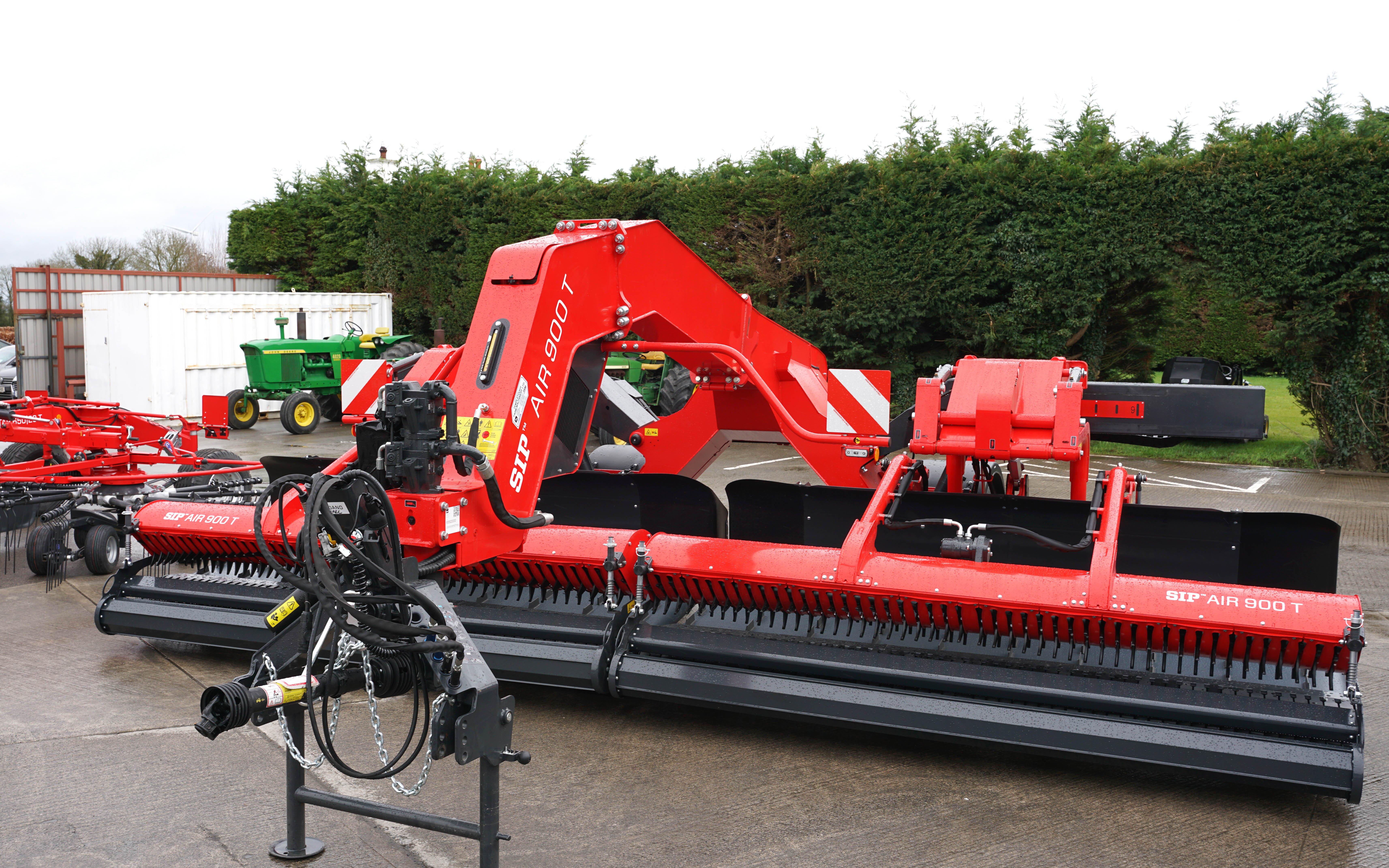 The two heads are mounted on rails and may be moved in or out hydraulically