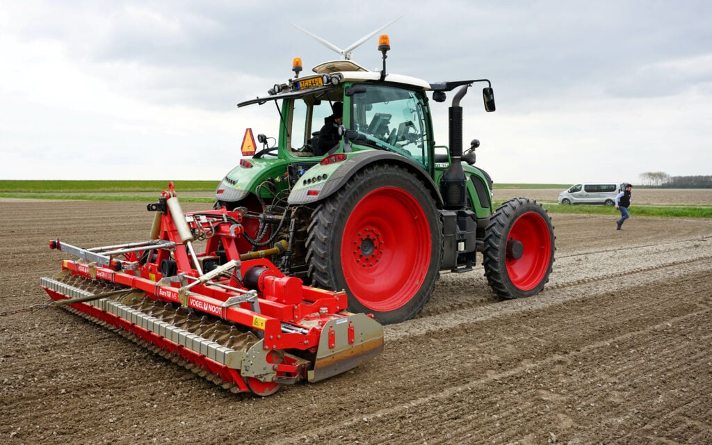 A shallow pass with power harrow and rollers prepares the seedbed for the next crop