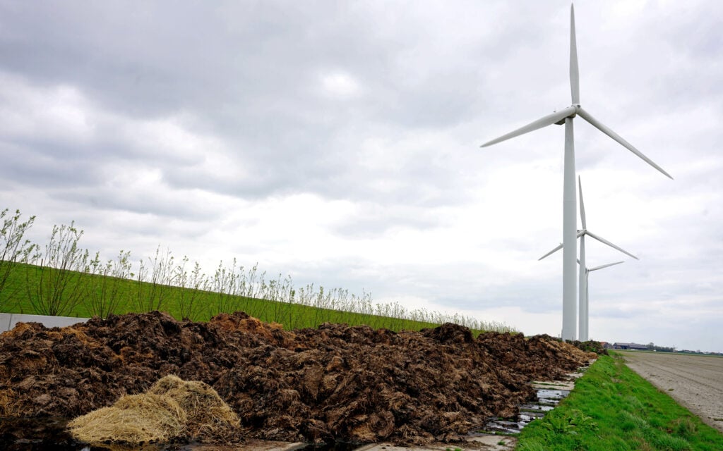 The goat muck is stored on a concrete pad between the polder and dyke