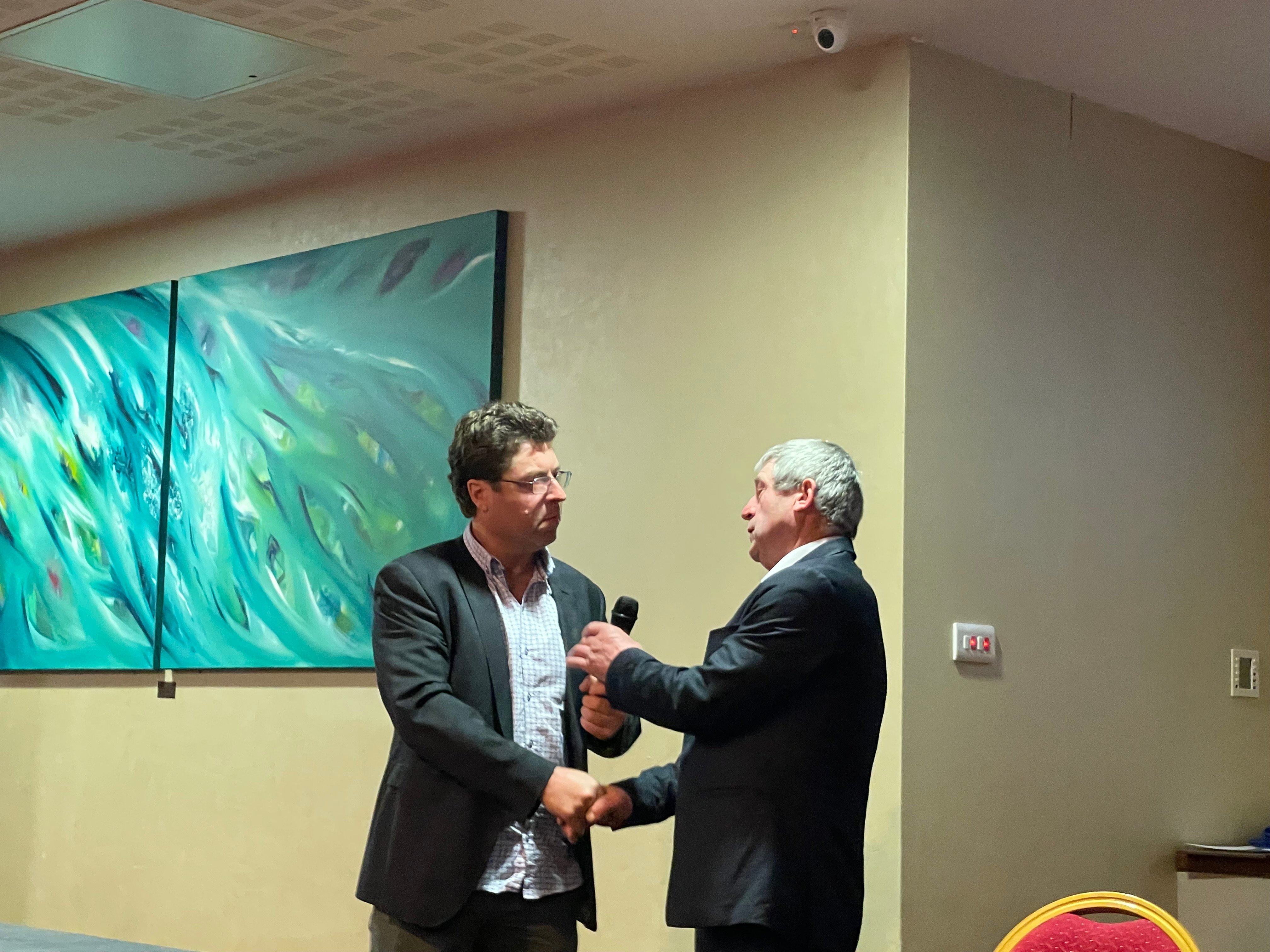 Kenneth O'Connell (left) congratulates Kenny Jones on his re-election as Kerry IFA chair
