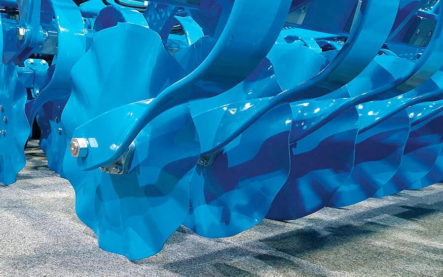 The optional corrugated discs cultivate a strip ahead of the coulter, helping to preserve moisture