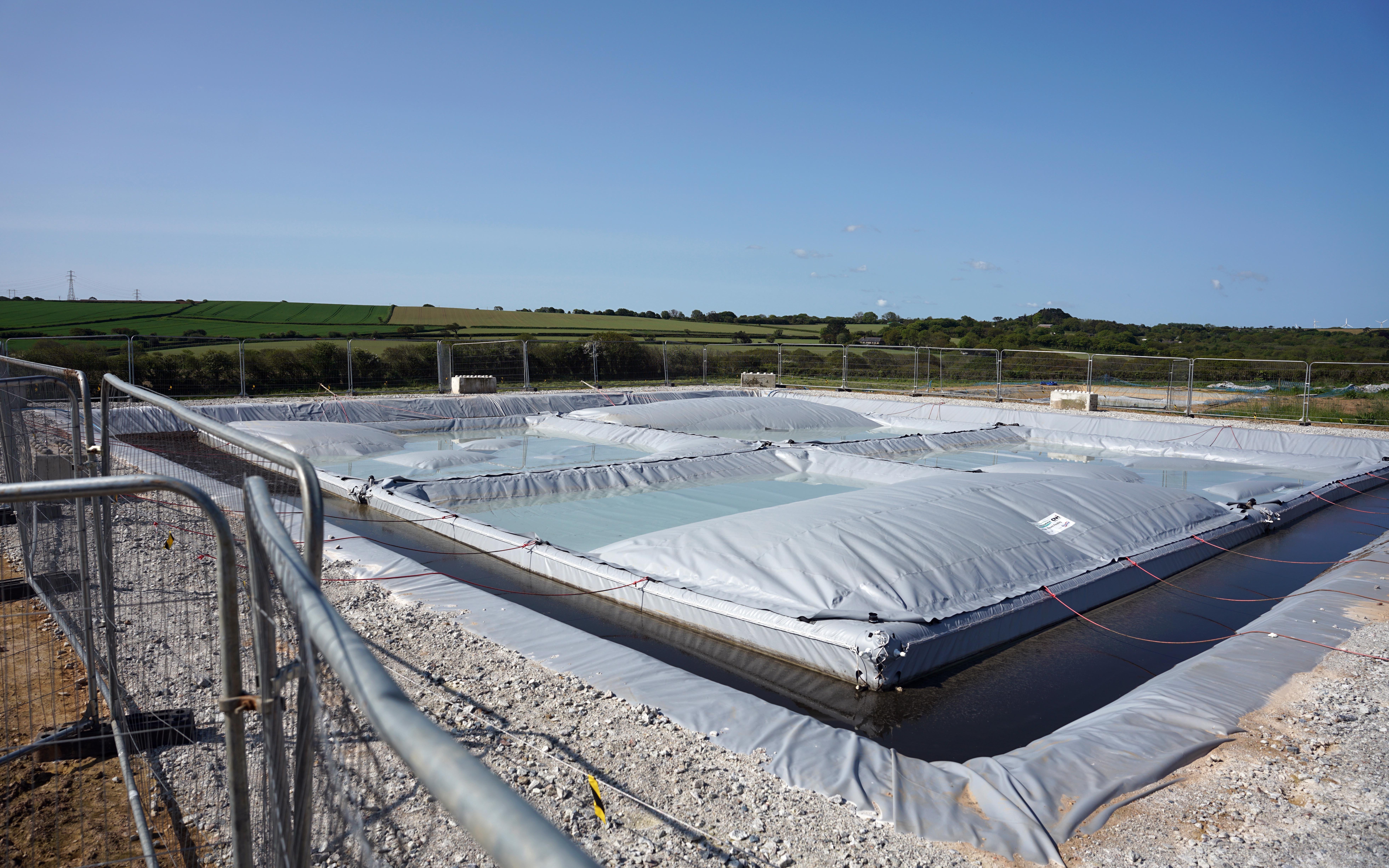The tile system undergoing stress tests. The liners would normally flat but here gas has been allowed to accumulate beneath them as part of the development work. A pump would normally remove the rainwater for dairy washing etc.
