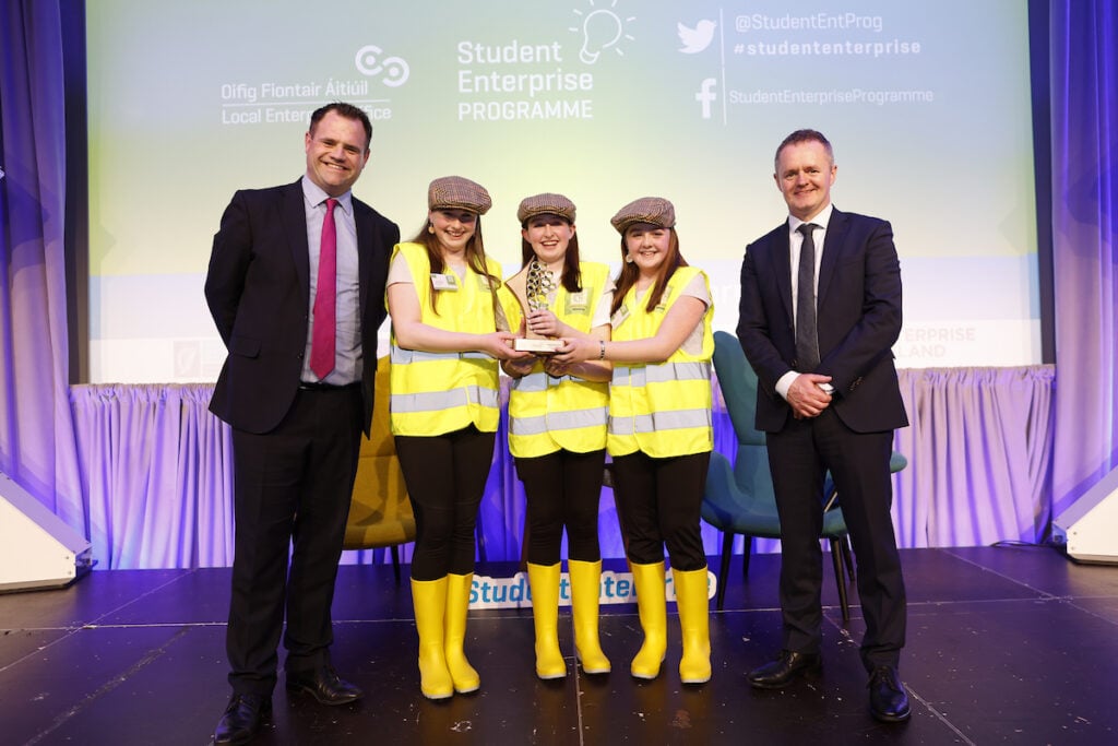 Minister Martin Heydon and John Magee, head of the Network of Local Enterprises Offices of Ireland congratulating the students on their big win