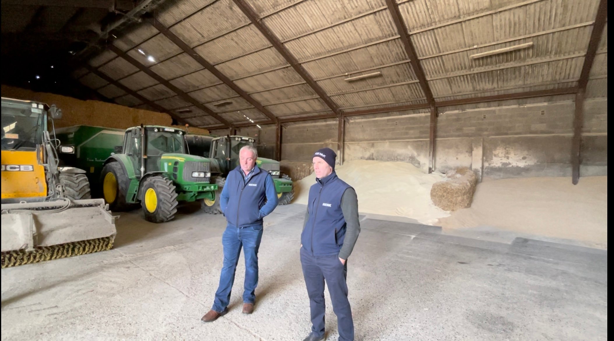 Farm manager Sam Myles and Jonathan Forbes explaining the feed programme on the farm