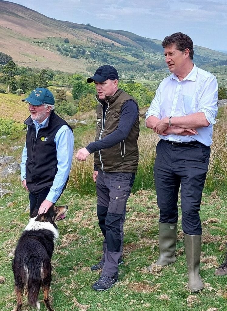 Bob the sheepdog with ministers Malcolm Noonan and Eamon Ryanand NPWS manager Damian Clarke. Image: Malcolm Noonan Twitter