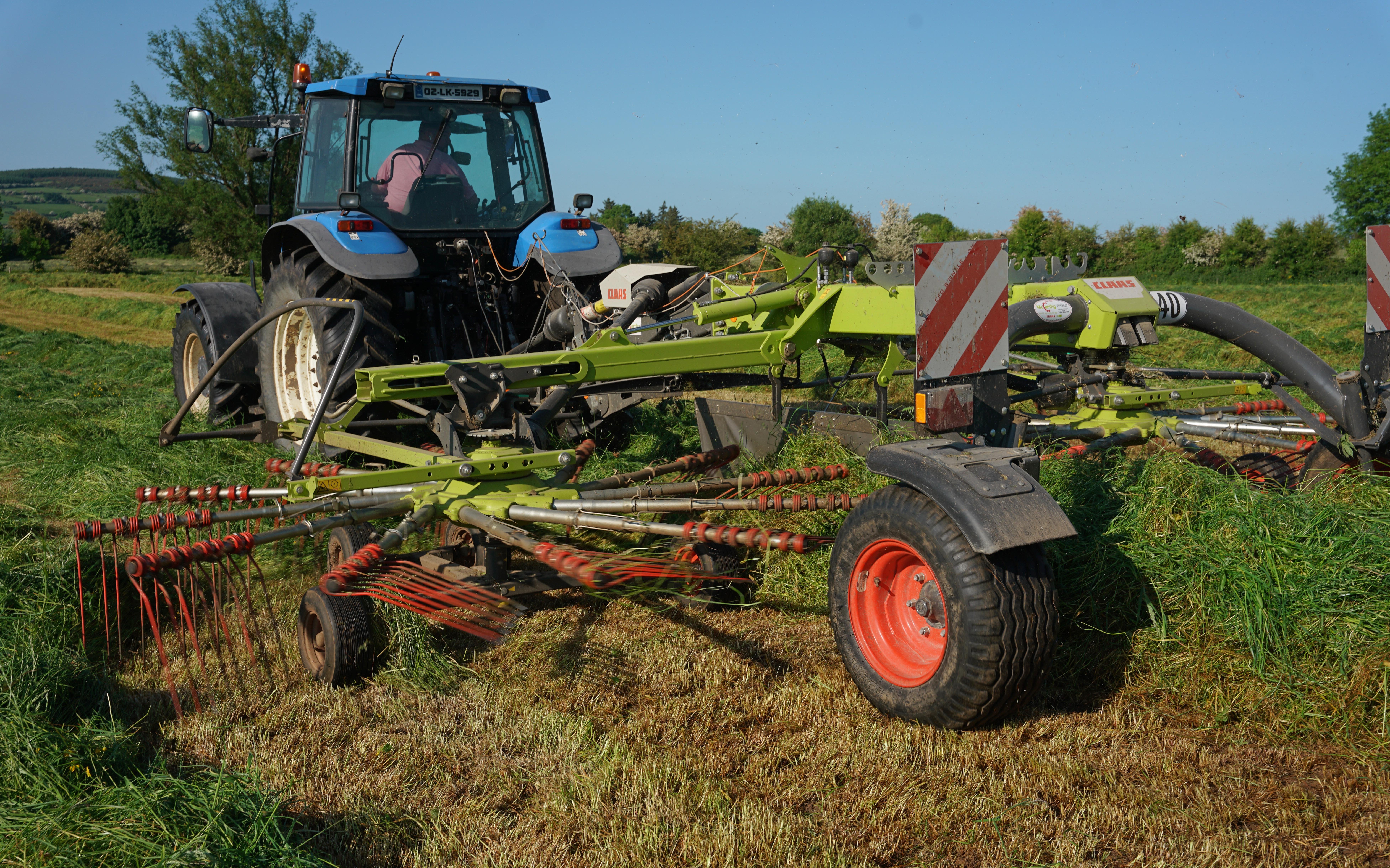 Rare for Ireland, the crop was being raked immediately to stop it drying out too much