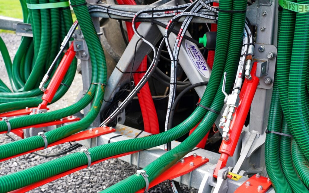 The boom is mounted on a three-point linkage allowing for easy removal or swapping between tanker and umbilical system