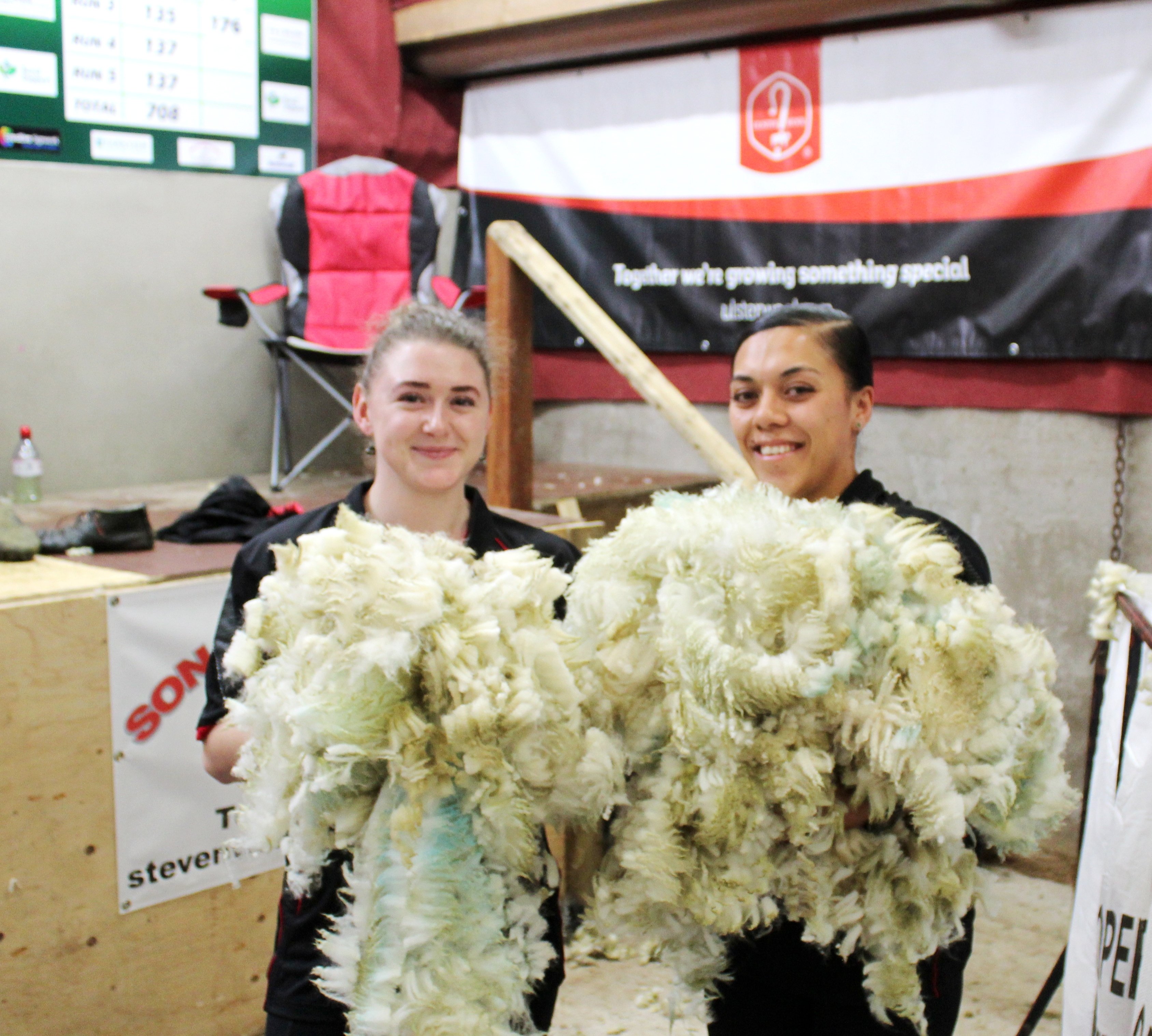 (L-R) India Clarke, from the Falkland Islands and Chloe Ransfiled, from New Zealand, who cleared the wool from the stage throughout the record-breaking attempt