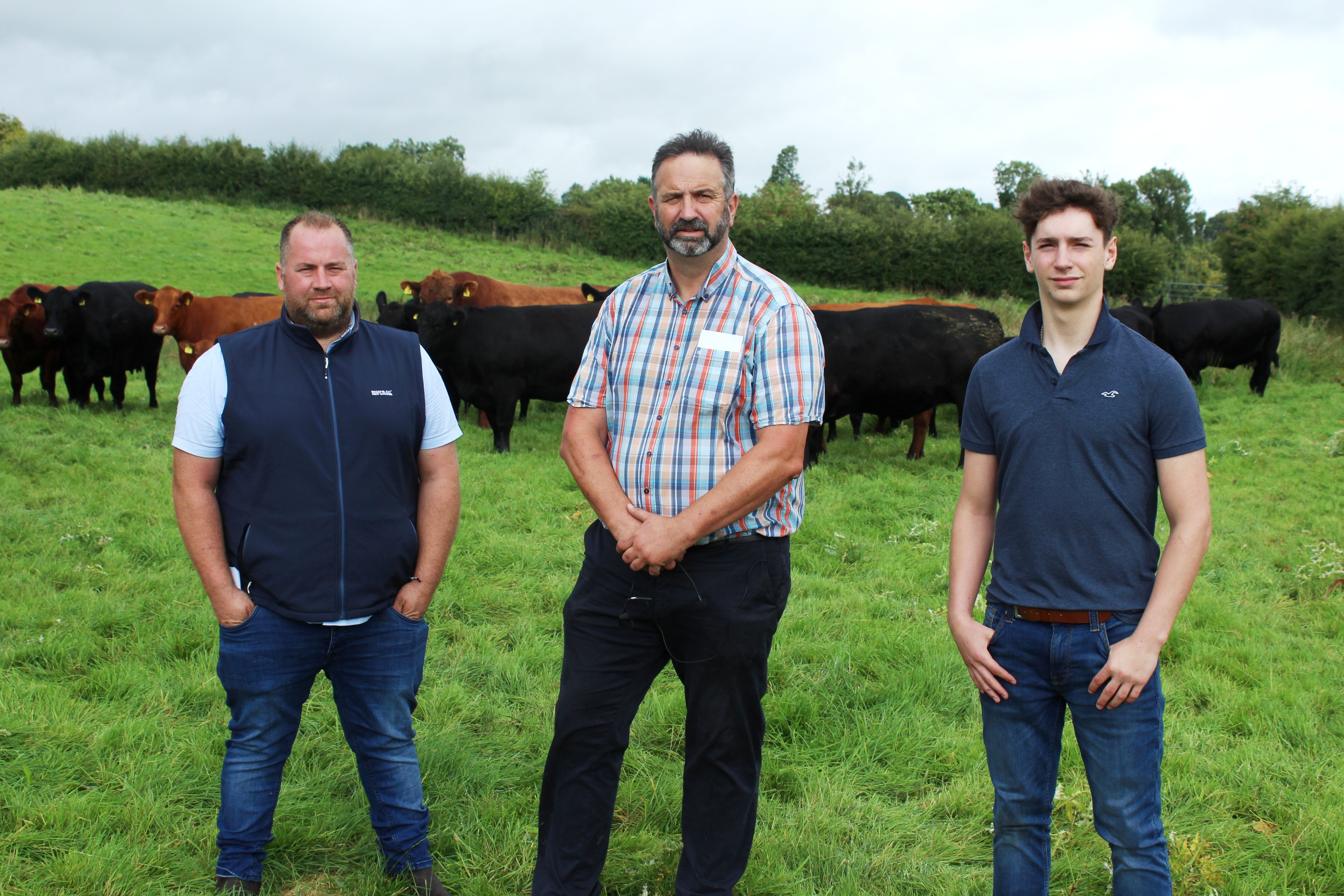 Aberdeen Angus farm walk host, Ian Browne, (centre) his son Harry (right) and farm manager, Richard Smyton