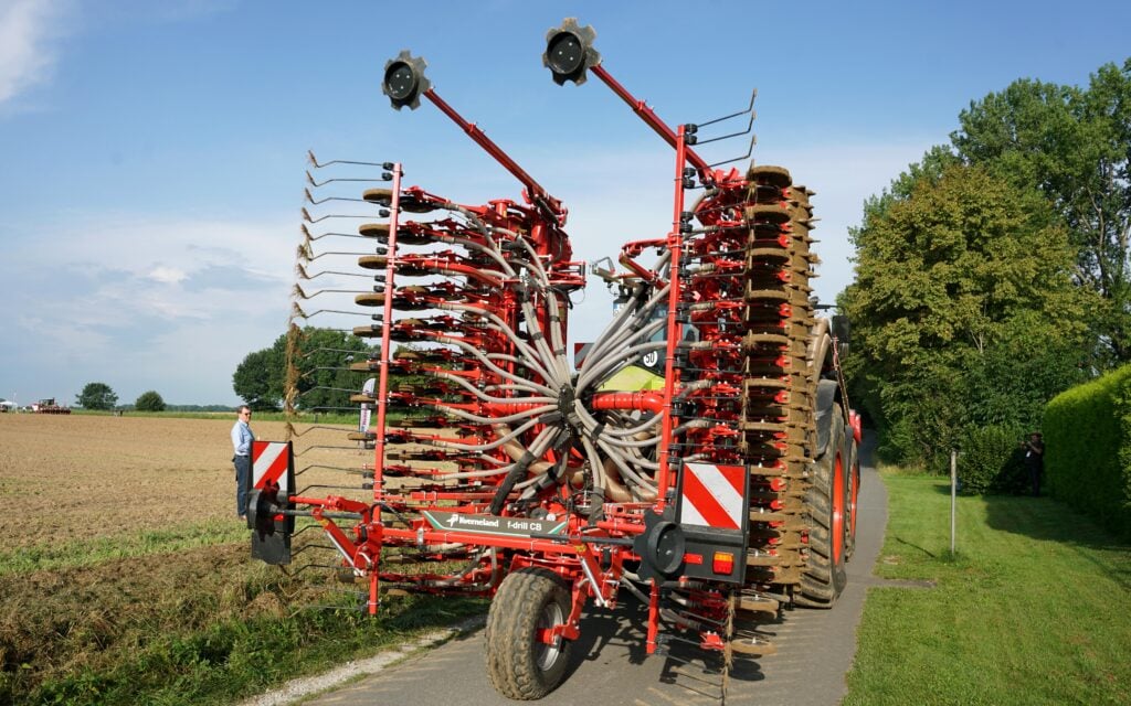 The transport wheel folds down to alleviate the weight on the tractor when on the road