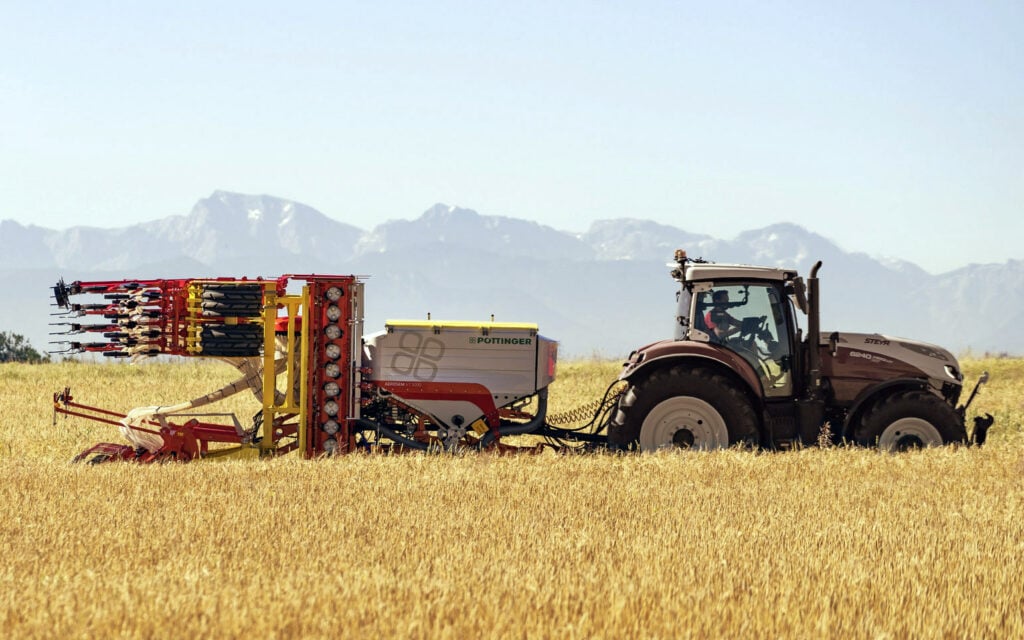 Moving the hopper forward allows room for the power harrow to fold up