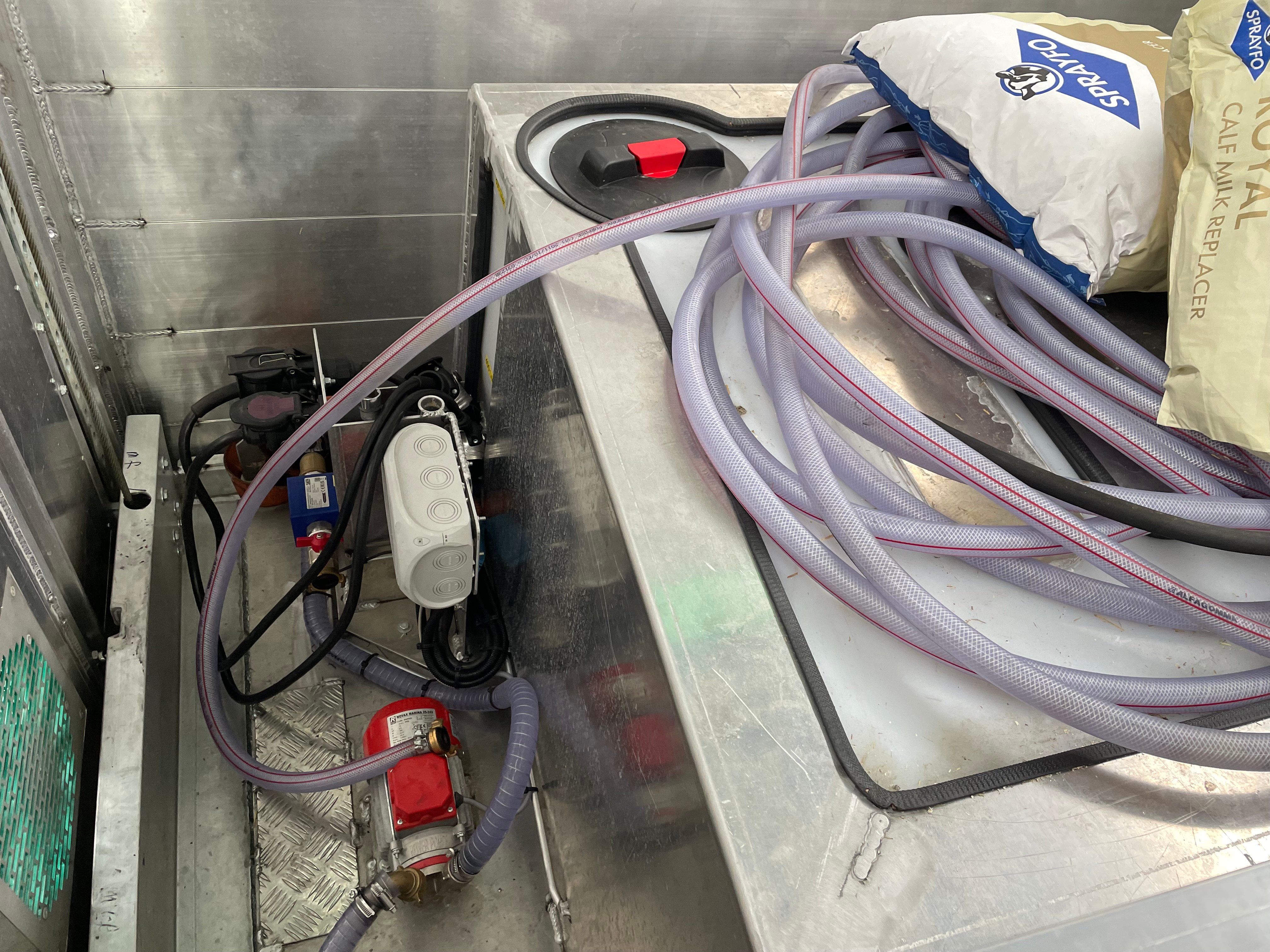 The pump in the lorry for distributing warm milk to the feeders in each pen