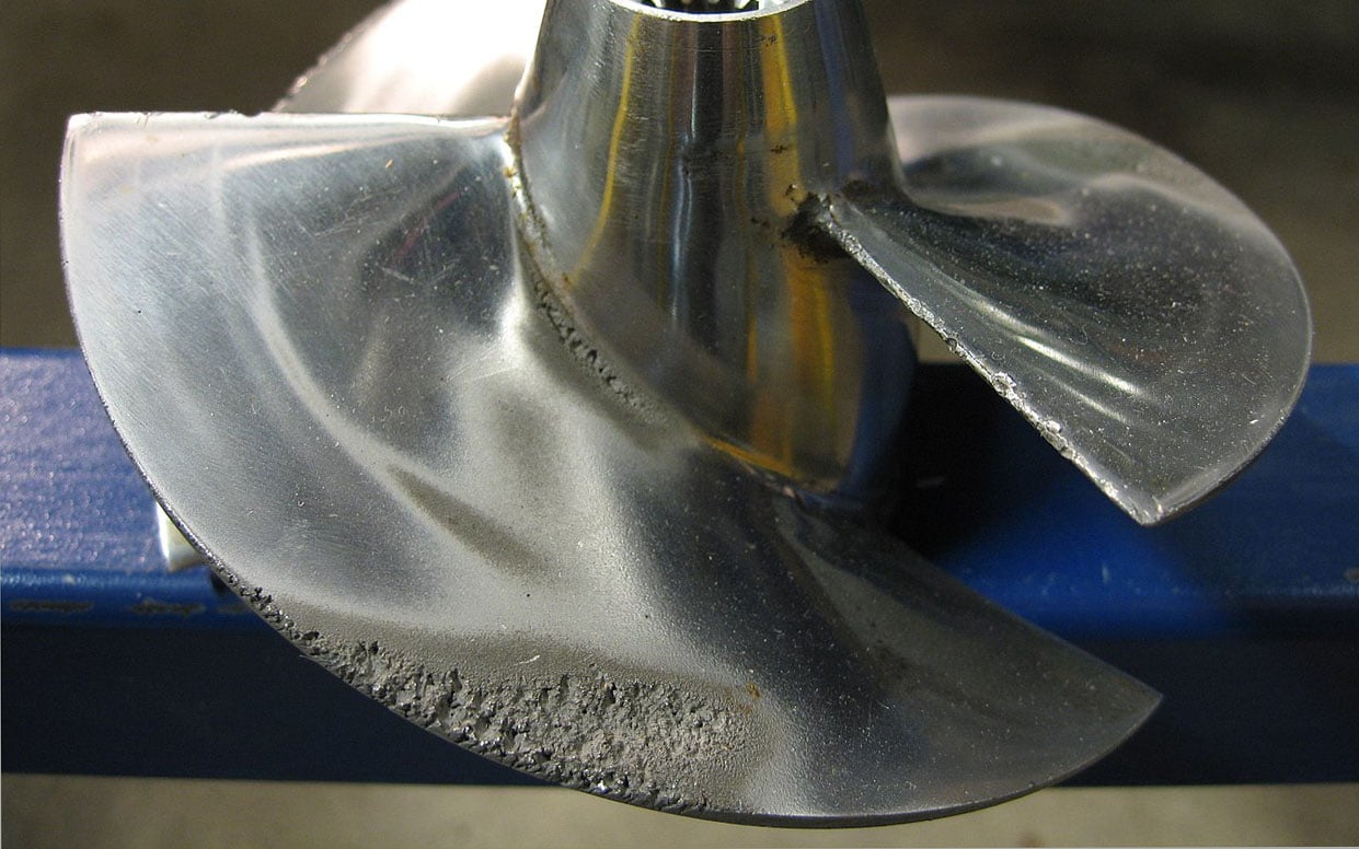 The effect of cavitation on the blade of a boat propeller