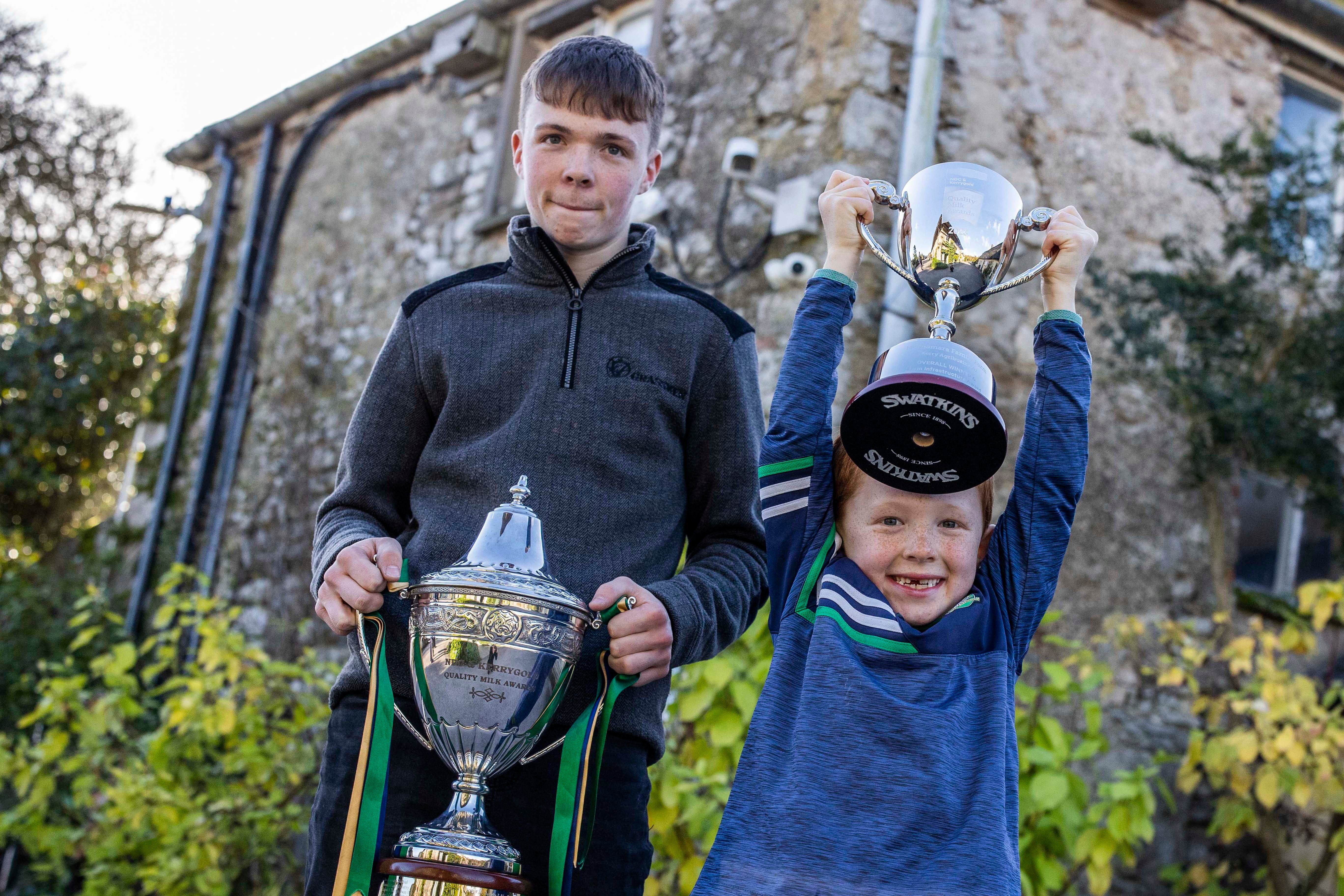 Padraic and Conor Macnamara hold the trophies on behalf of the Macnamara Farm. Source: Clare Keogh