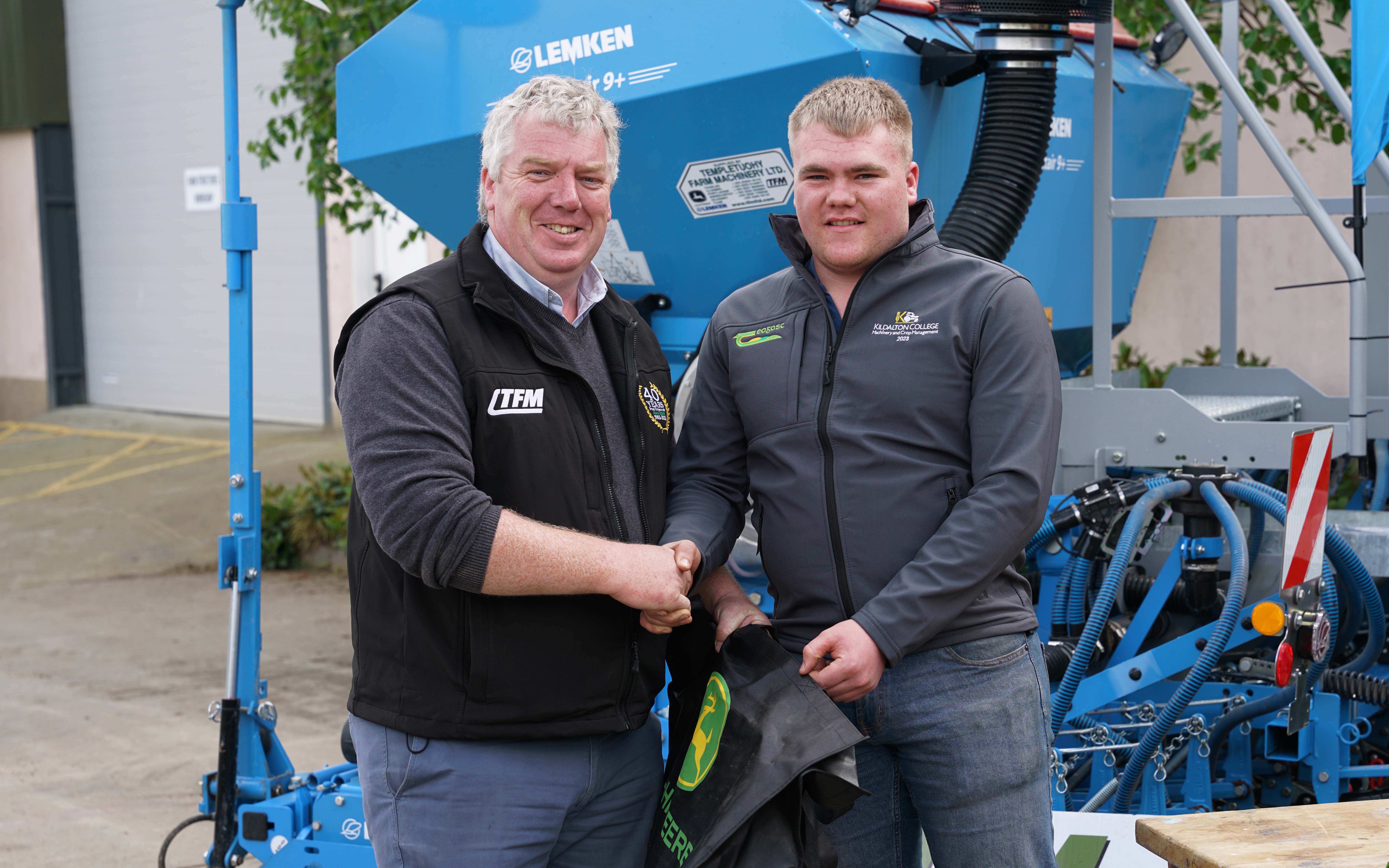 David Murray of Templetuohy Farm Machinery congratulates competition runner up, Sam Ennis