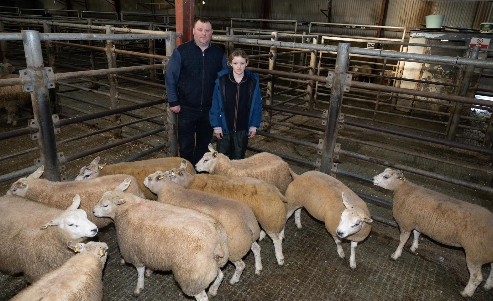 Martha-Jane McConnell pictured with Ciaran McCullagh of Ciaran’s Butchers, who purchased the supreme and reserve champion lambs Source: Raphoe Livestock Mart