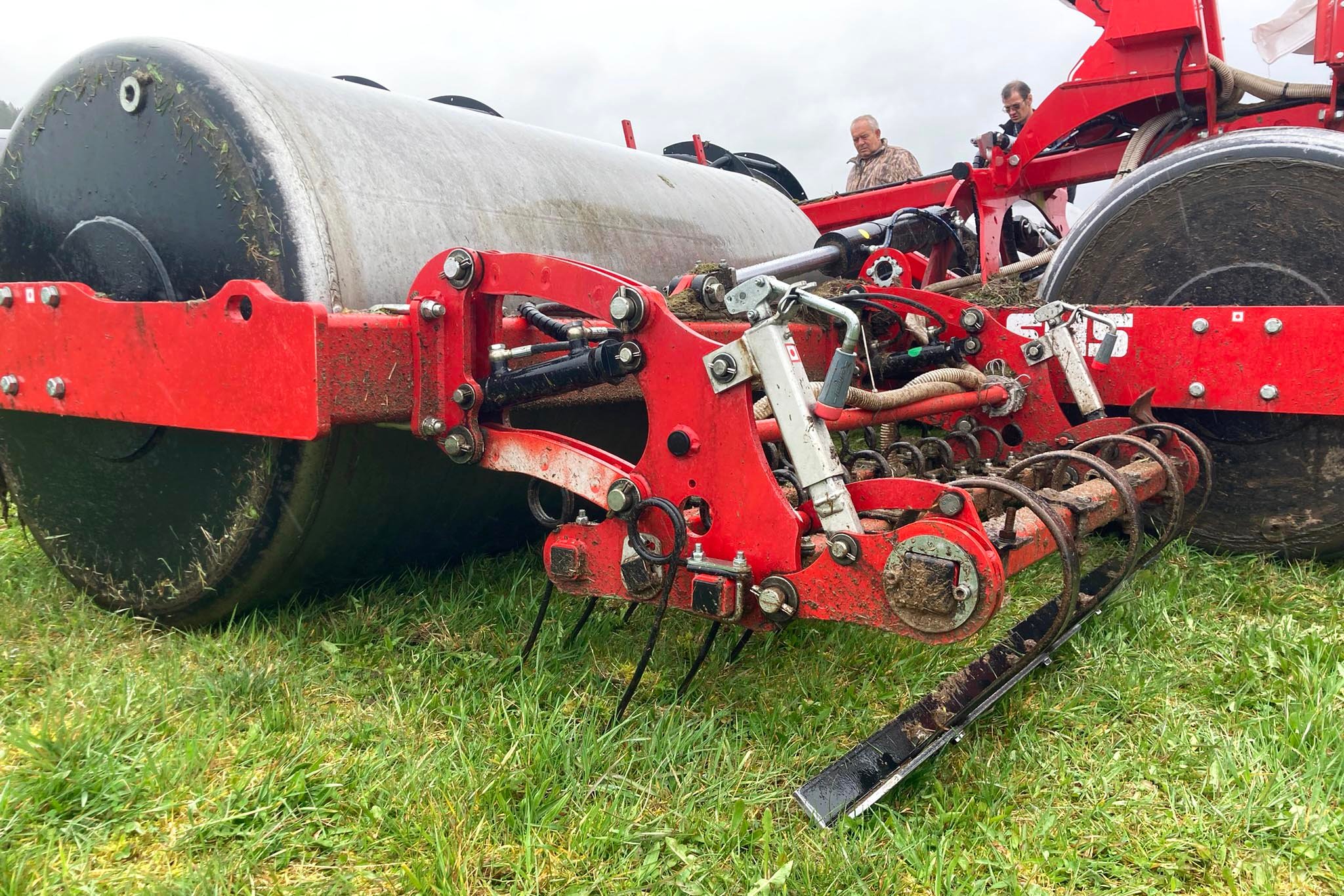 Spring tines and an adjustable spring mounted levelling board add to the utility of the roller