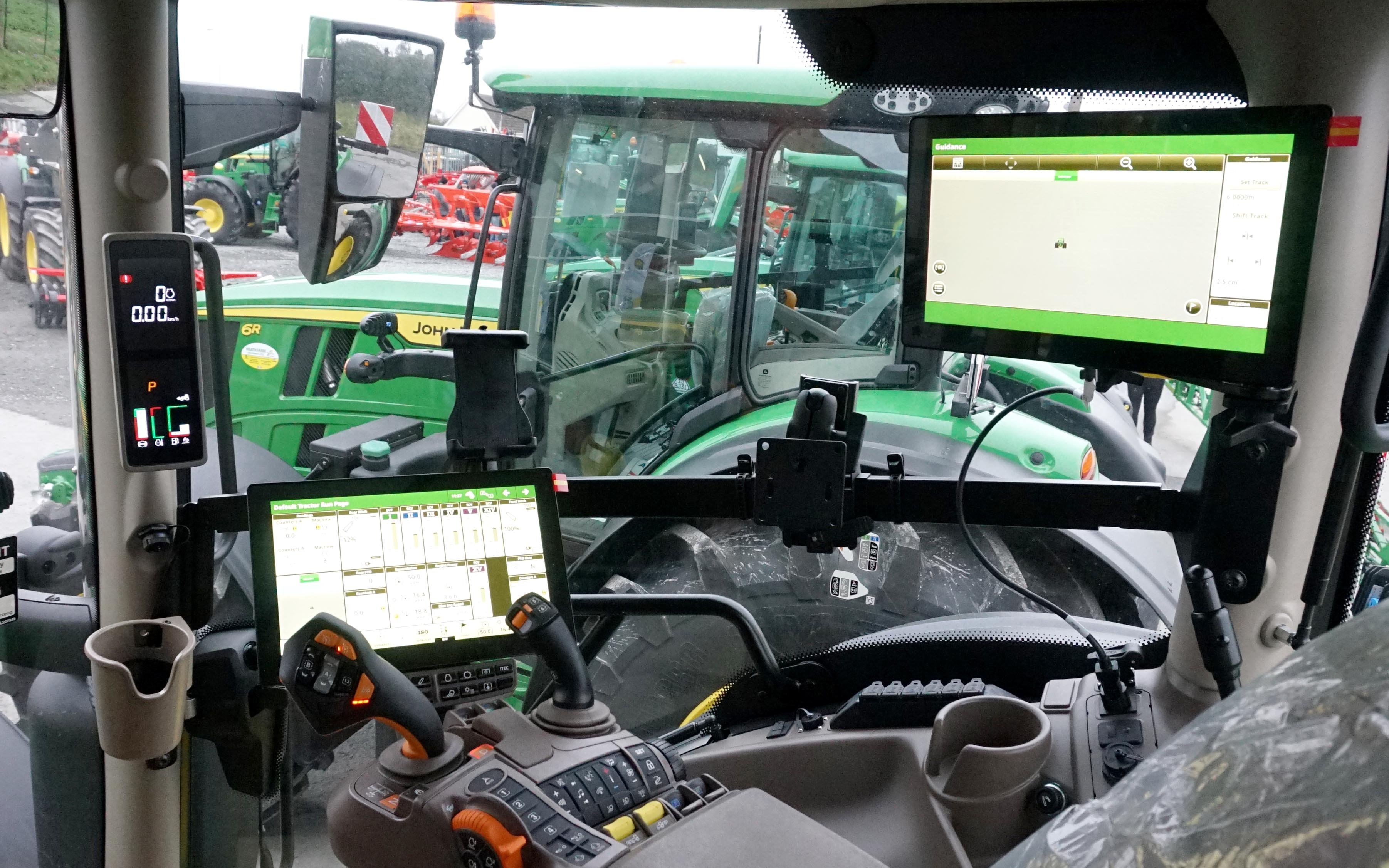 Three screens relay information to the operator and office on tractor functions and field operations