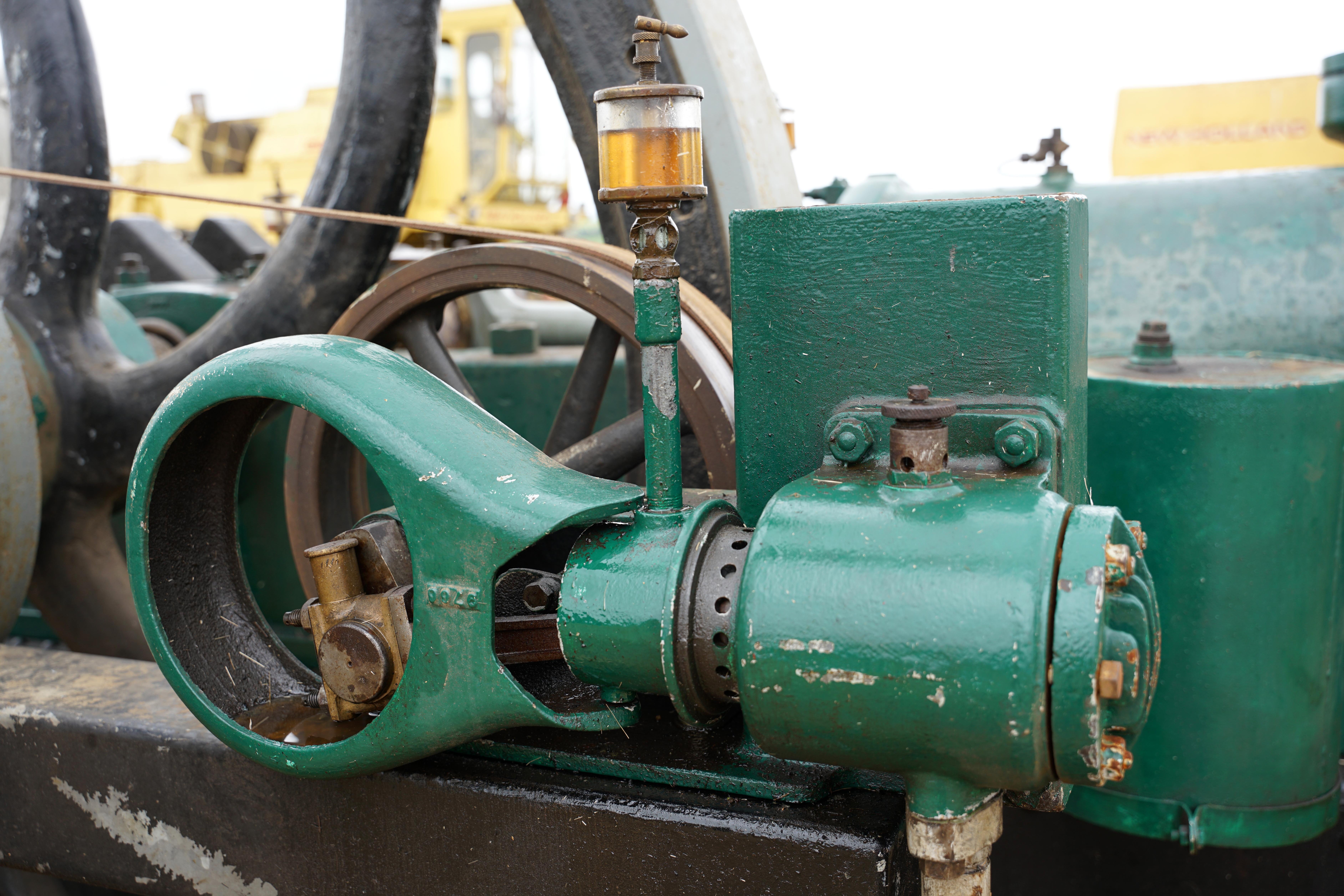 The compressor, mounted on the side of the engine, feeds a storage tank mounted at the front. No batteries or hand cranking required