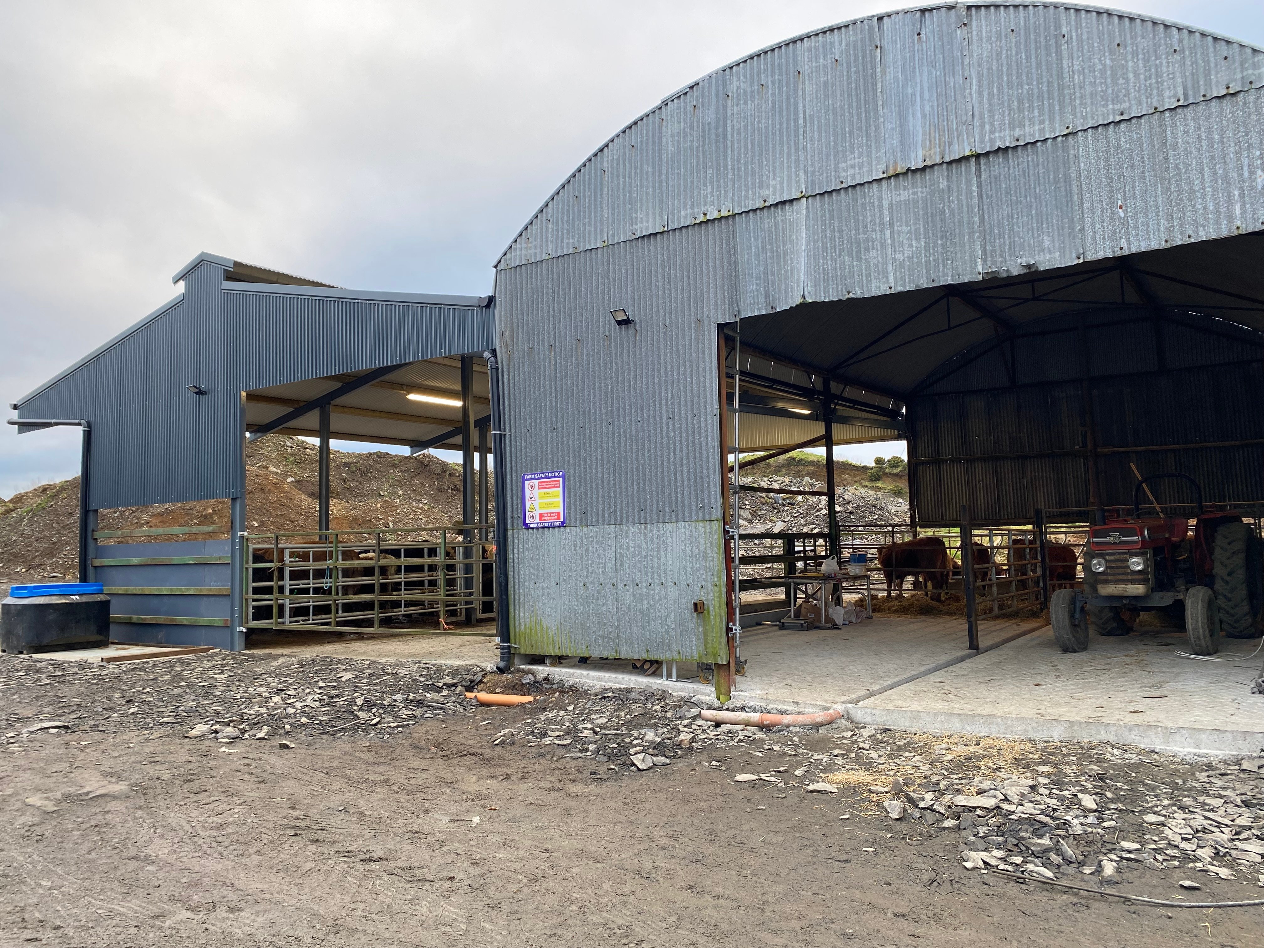The existing hay shed (right). The pipe (front centre) will be concreted over and brings run from the dry-bedded area to the tank