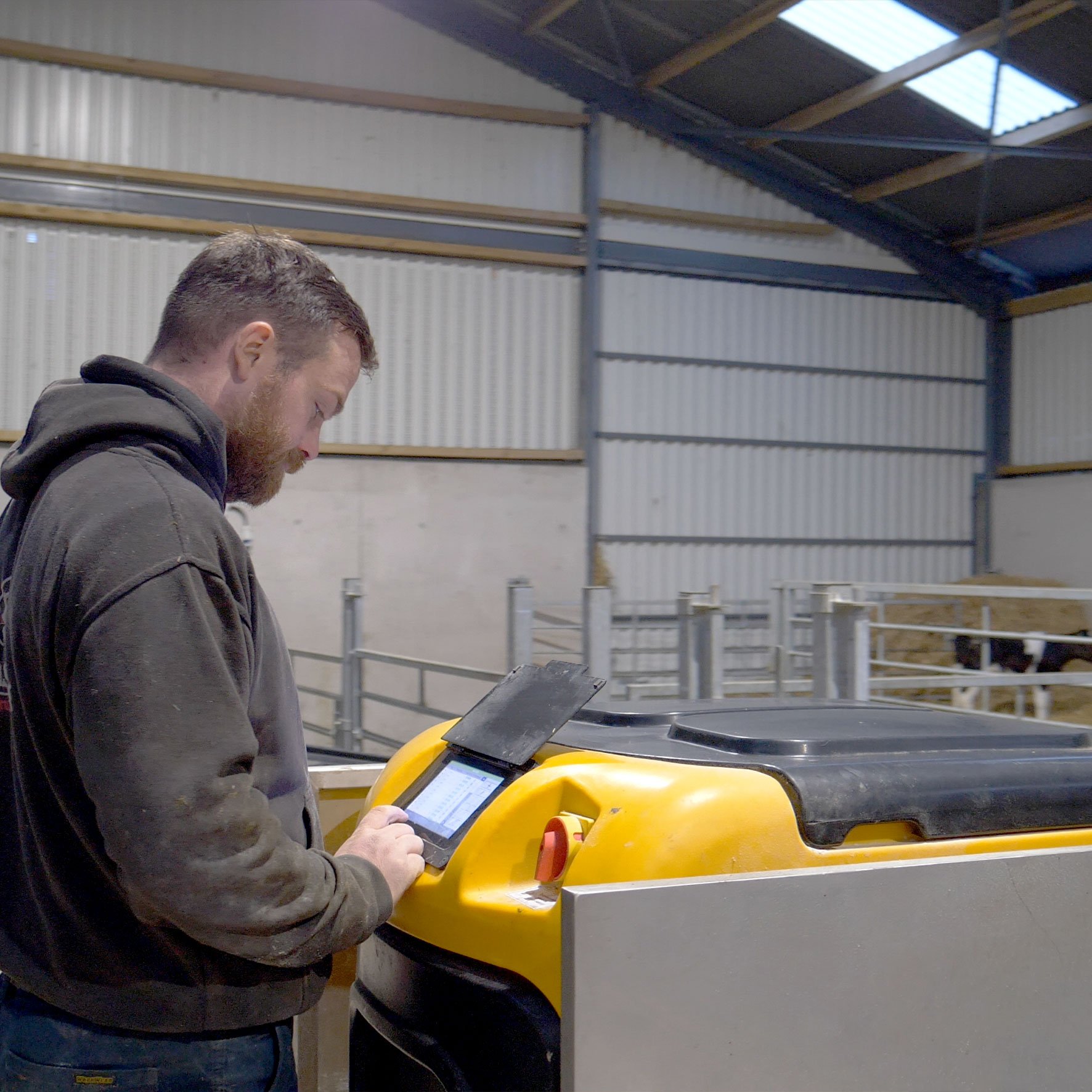 Andy Cashman pictured with the JFC Evolution Automatic Calf Feeder