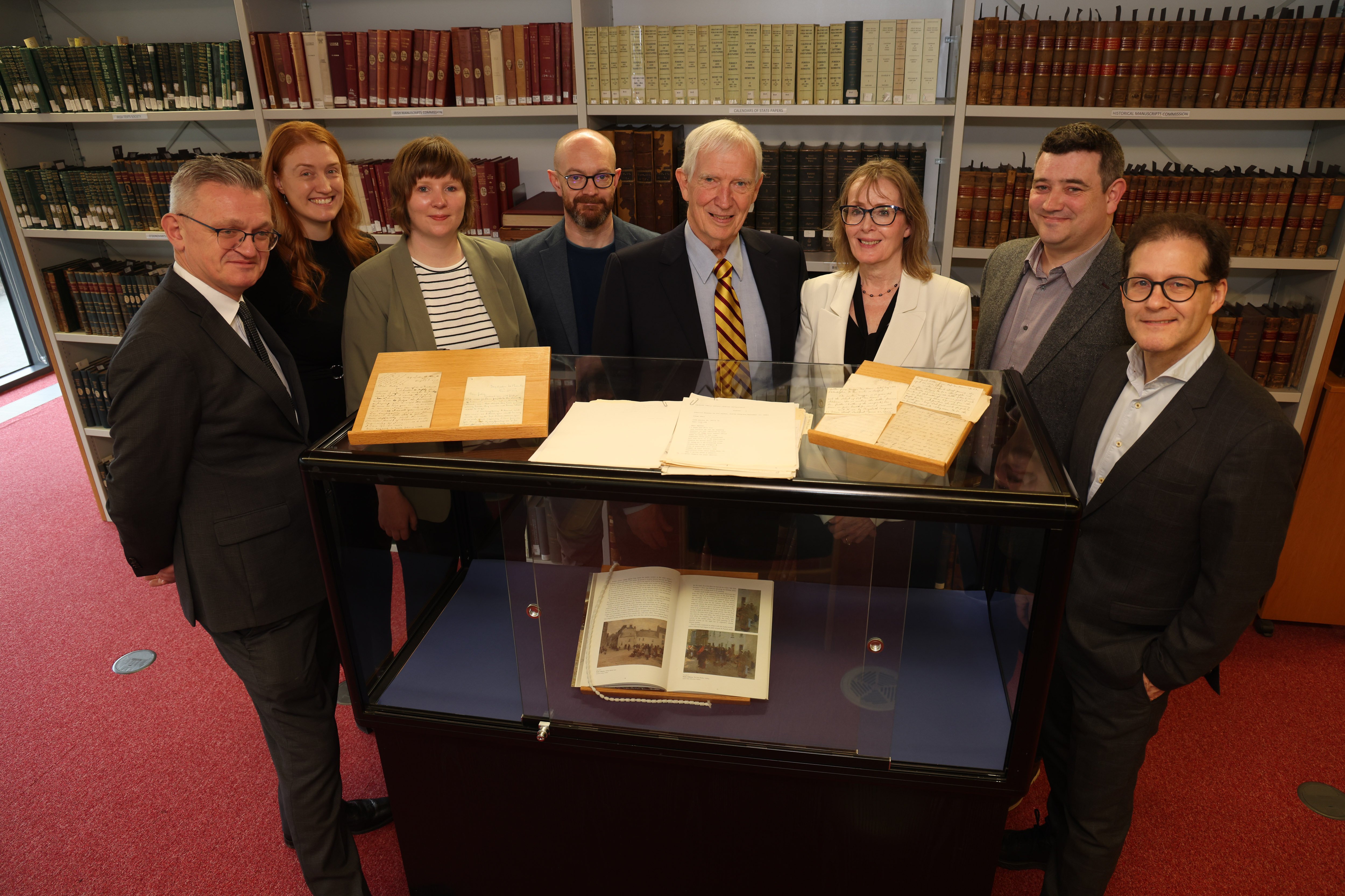 The Imirce digital project team in the University of Galway archives and special collections reading room. L-r: Breandán Mac Suibhne, Acadamh na hOllscolaíochta Gaeilge; Marie-Louise Rouget, University of Galway library; Catriona Cannon, University of Galway Library;  Dr. Cillian Joy, University of Galway library; Kerby Miller; Patricia Miller; David Kelly Centre for Creative Technologies and Dan Carey, School of English, Media and Creative Arts. Image source: Aengus McMahon.