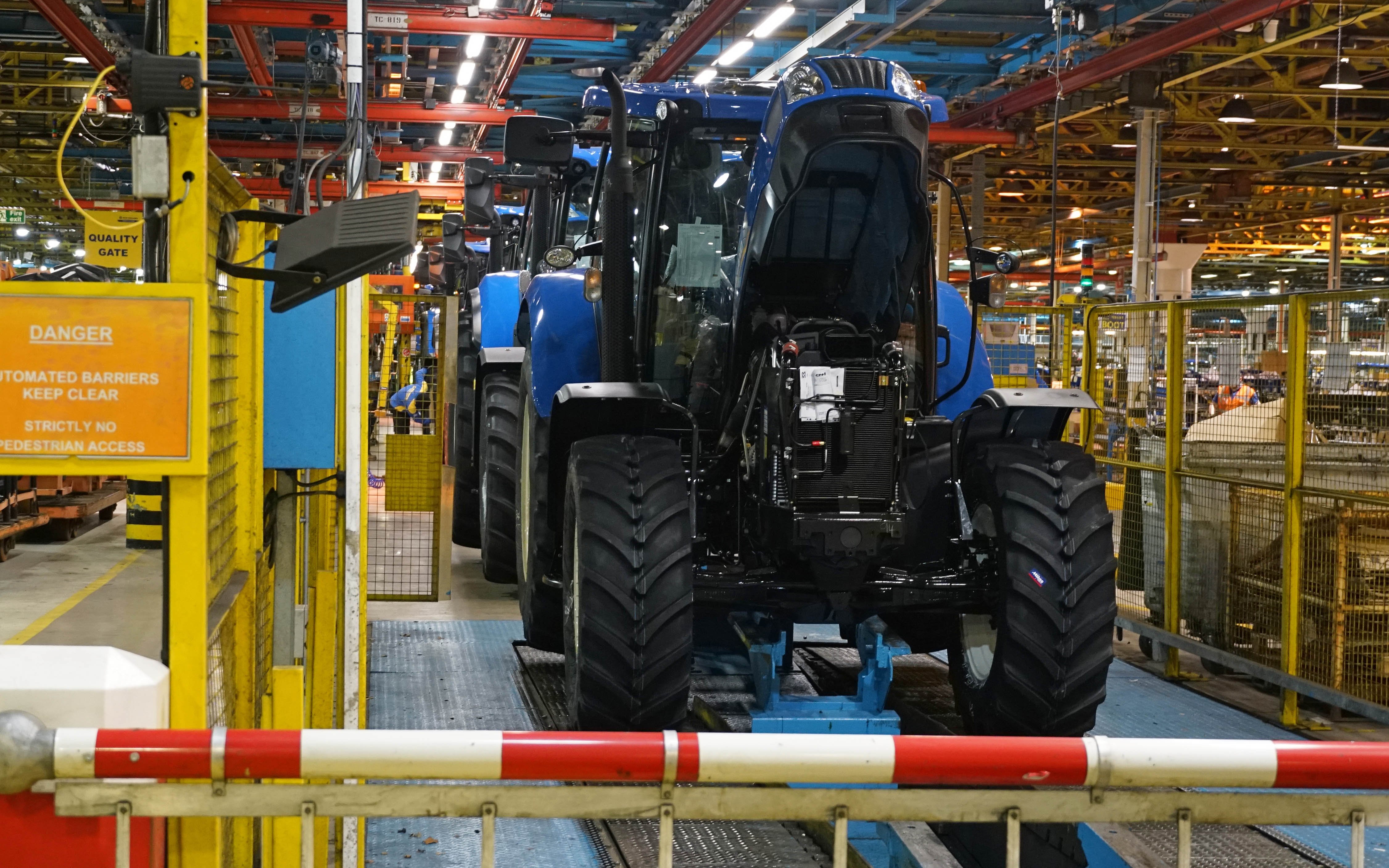 At the end of the line, the tractors are towed away for final calibration