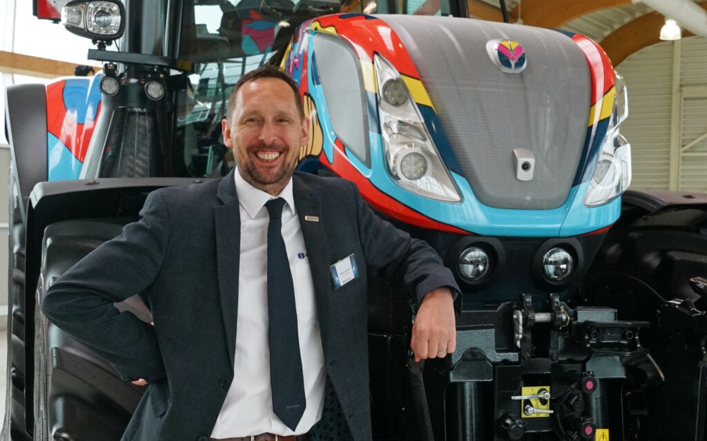 Sean Lennon Vice President Europe, New Holland, with the machine his Basildon team dressed for the 60th birthday