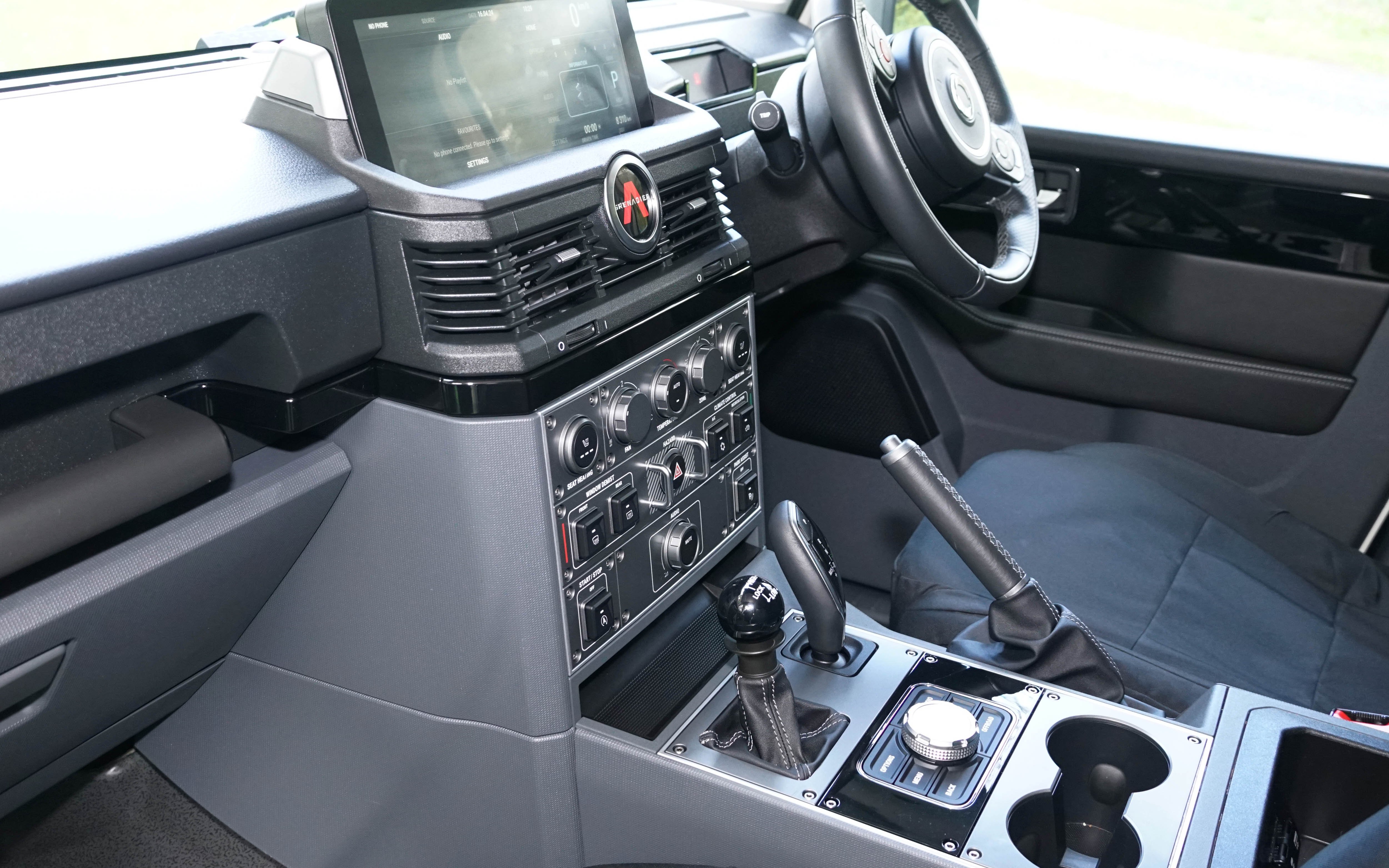No gear stick in the centre console, just the direction selector, range selector and manual handbrake