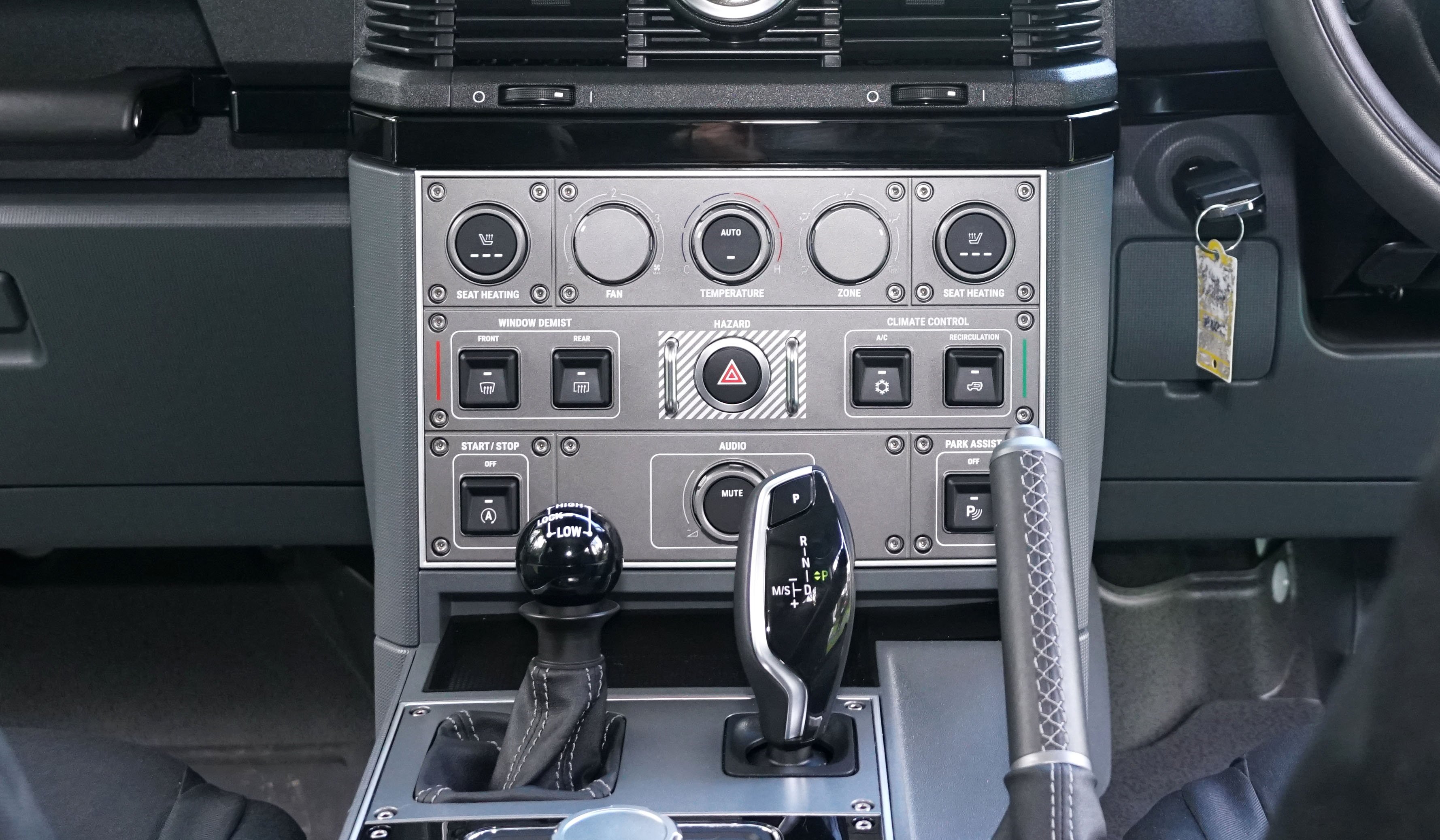 Transmission controls are set in the centre console next to a manual handbrake