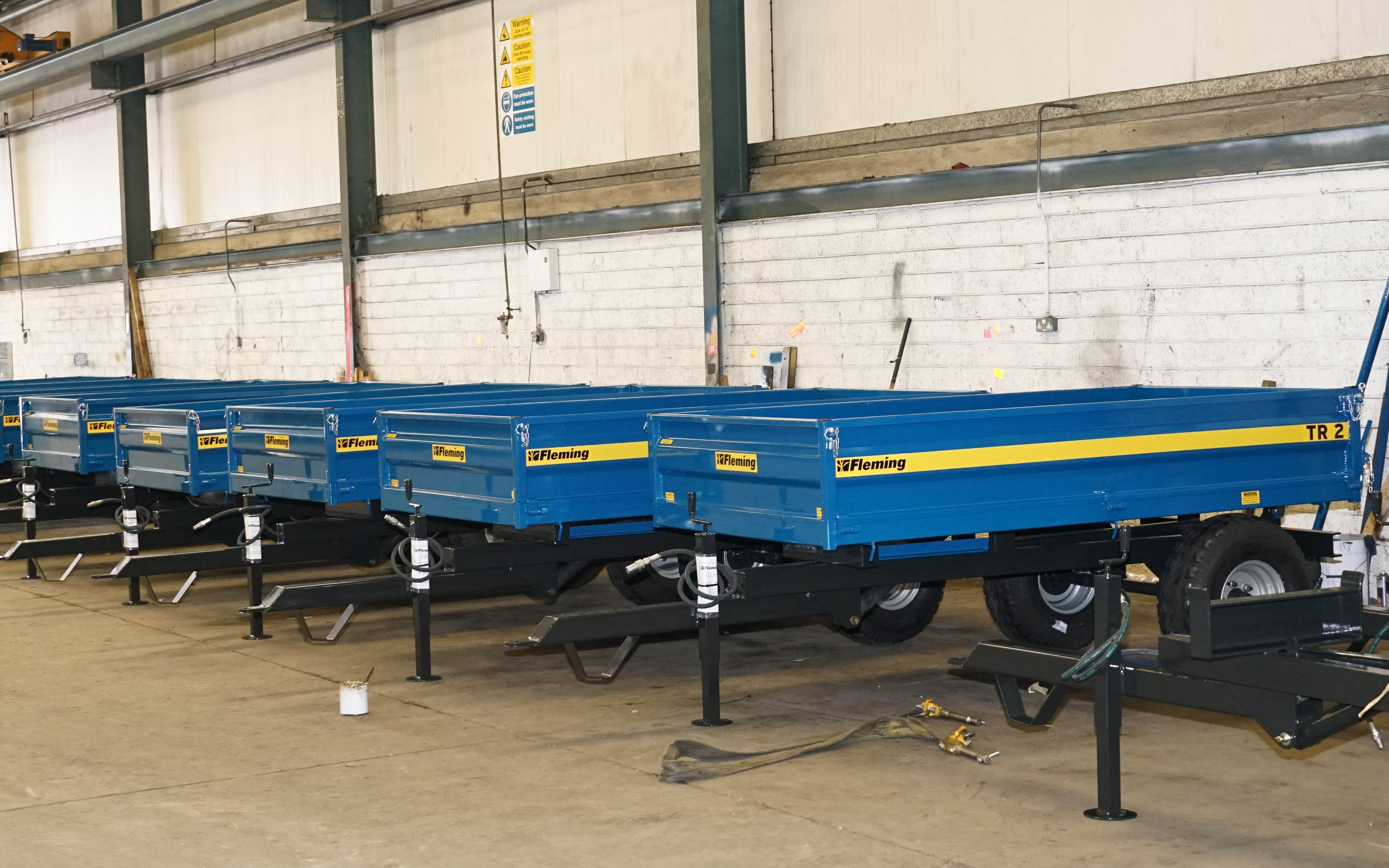 A batch of completed two tonne trailers await dispatch from the factory