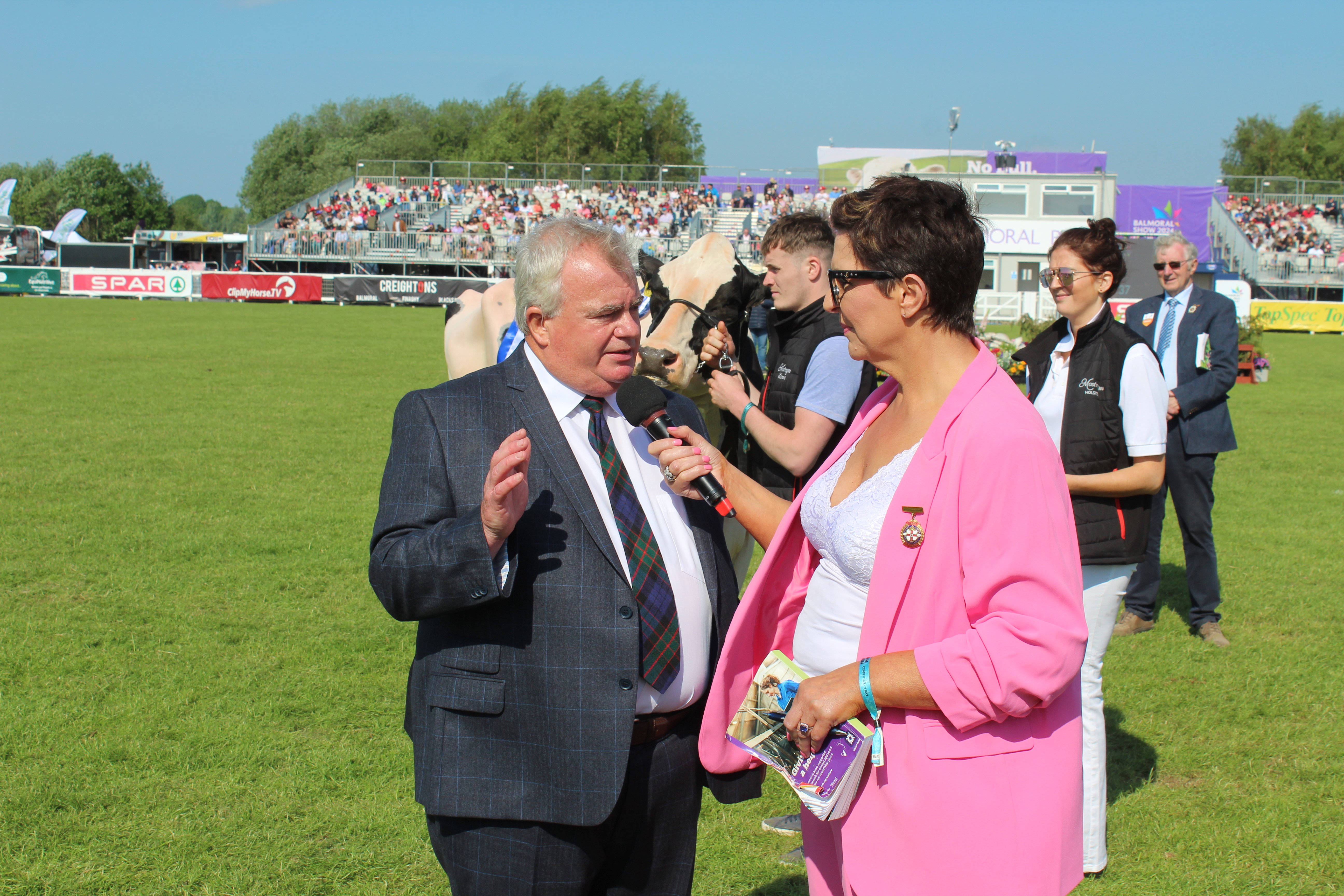 Champion of Champions judge, Ken Fletcher, chatting to master of ceremonies, Libby Clarke, in the show ring at Balmoral