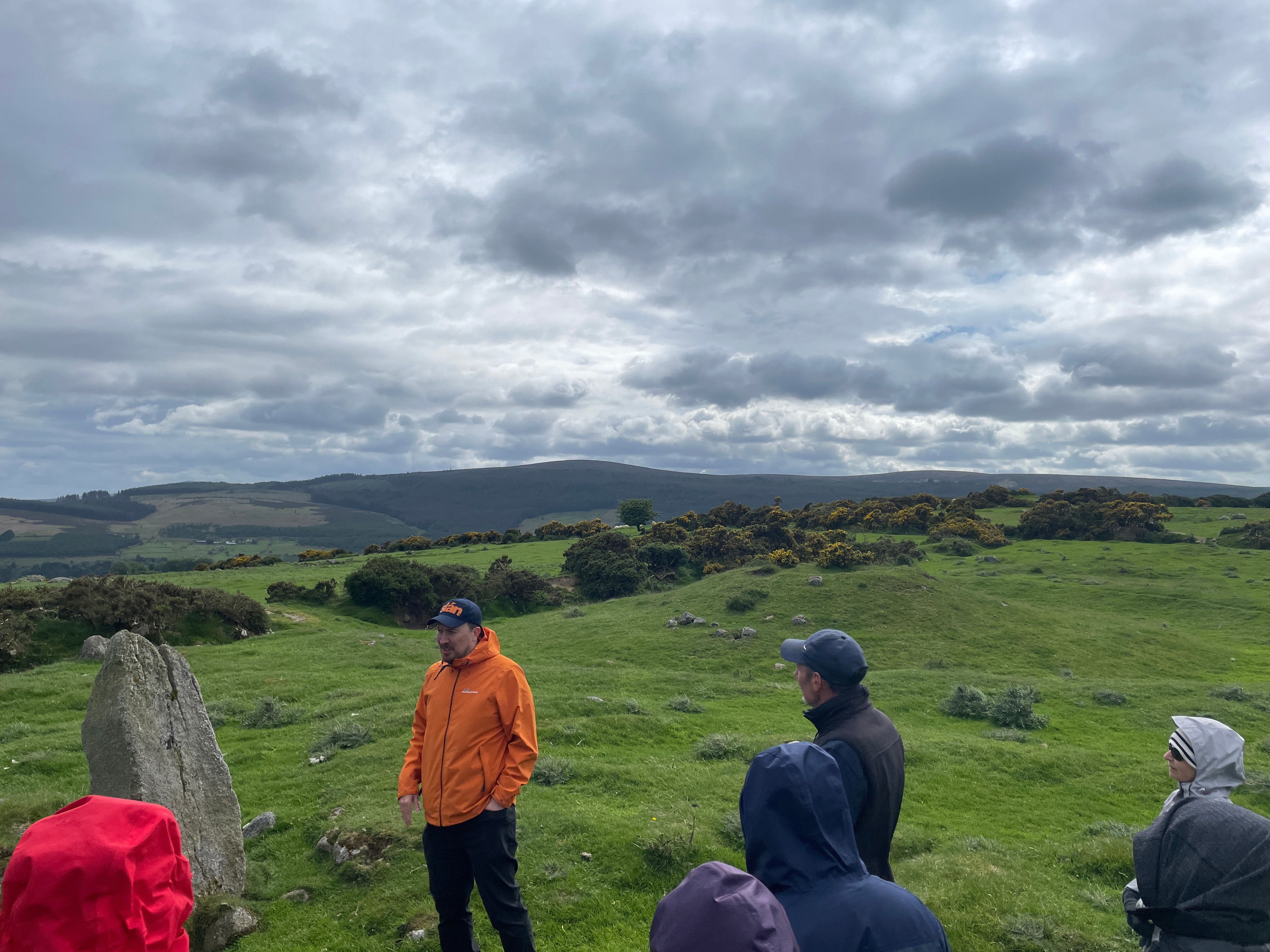 The standing stone and the nearby barrow
