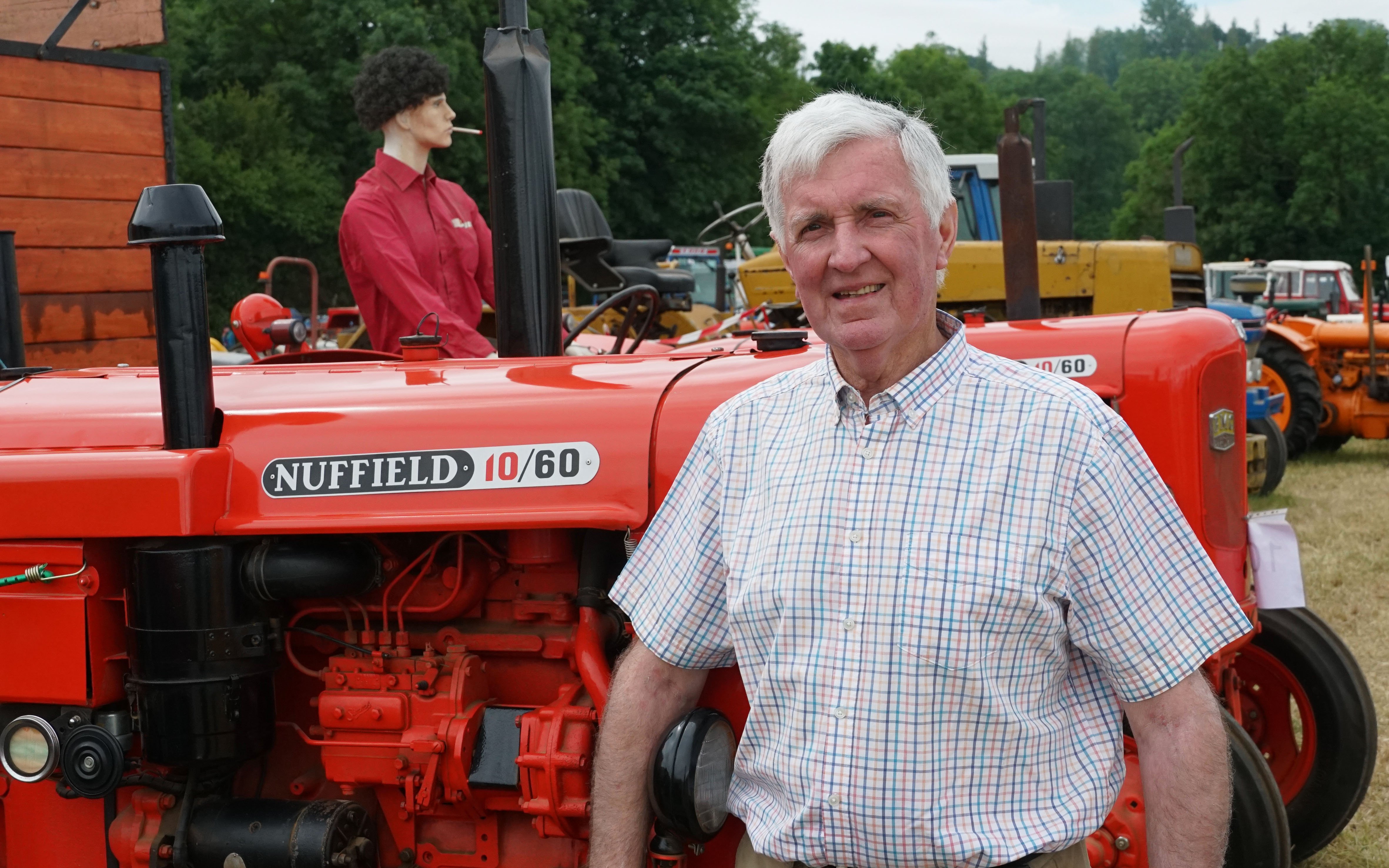 Barry Twohig with two of the Nuffields he operated in a contracting business along with a Kidd trailed harvester