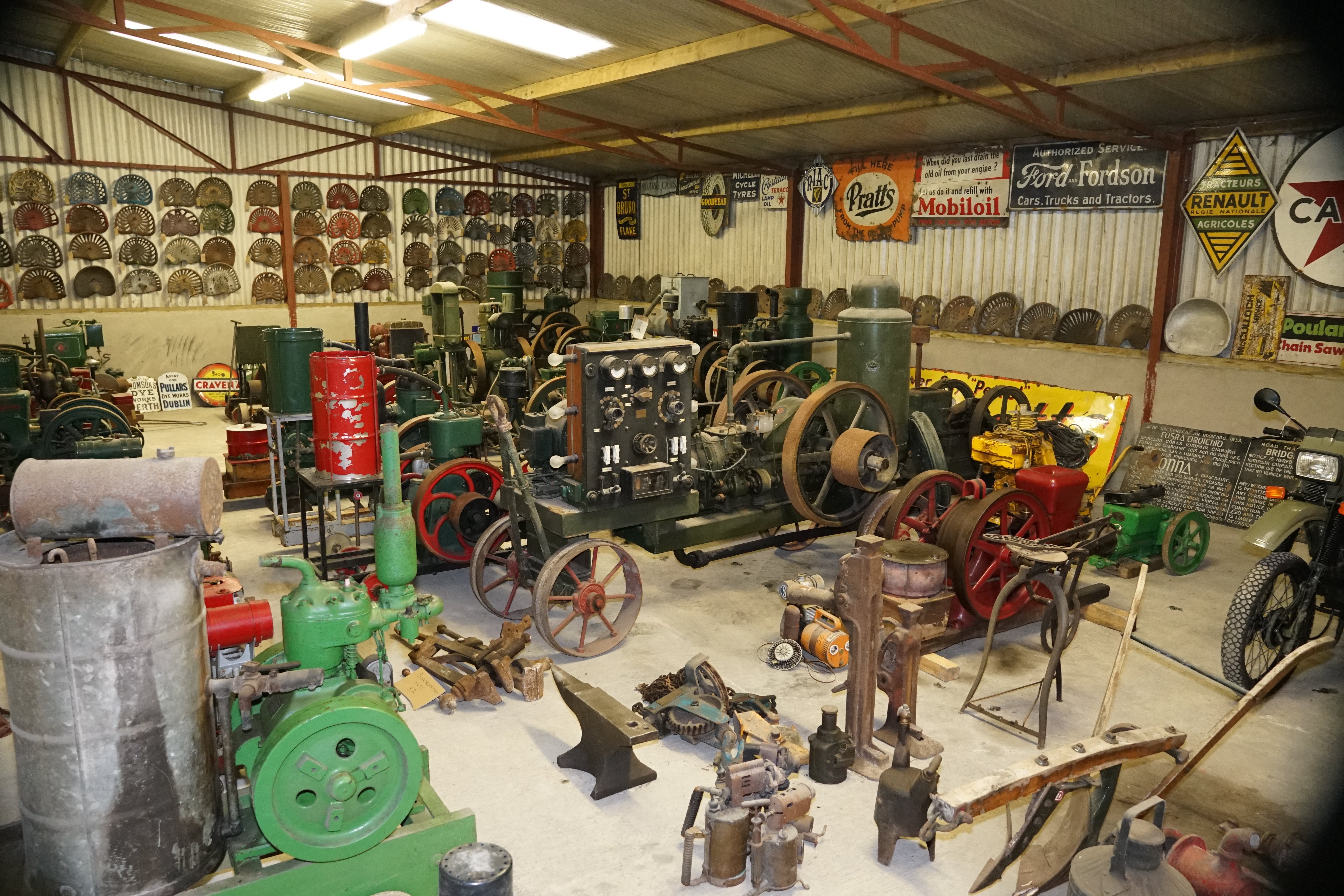 Stationary engines, enamel signs, bikes and general memorabilia in the shed at Breen's dispersal sale