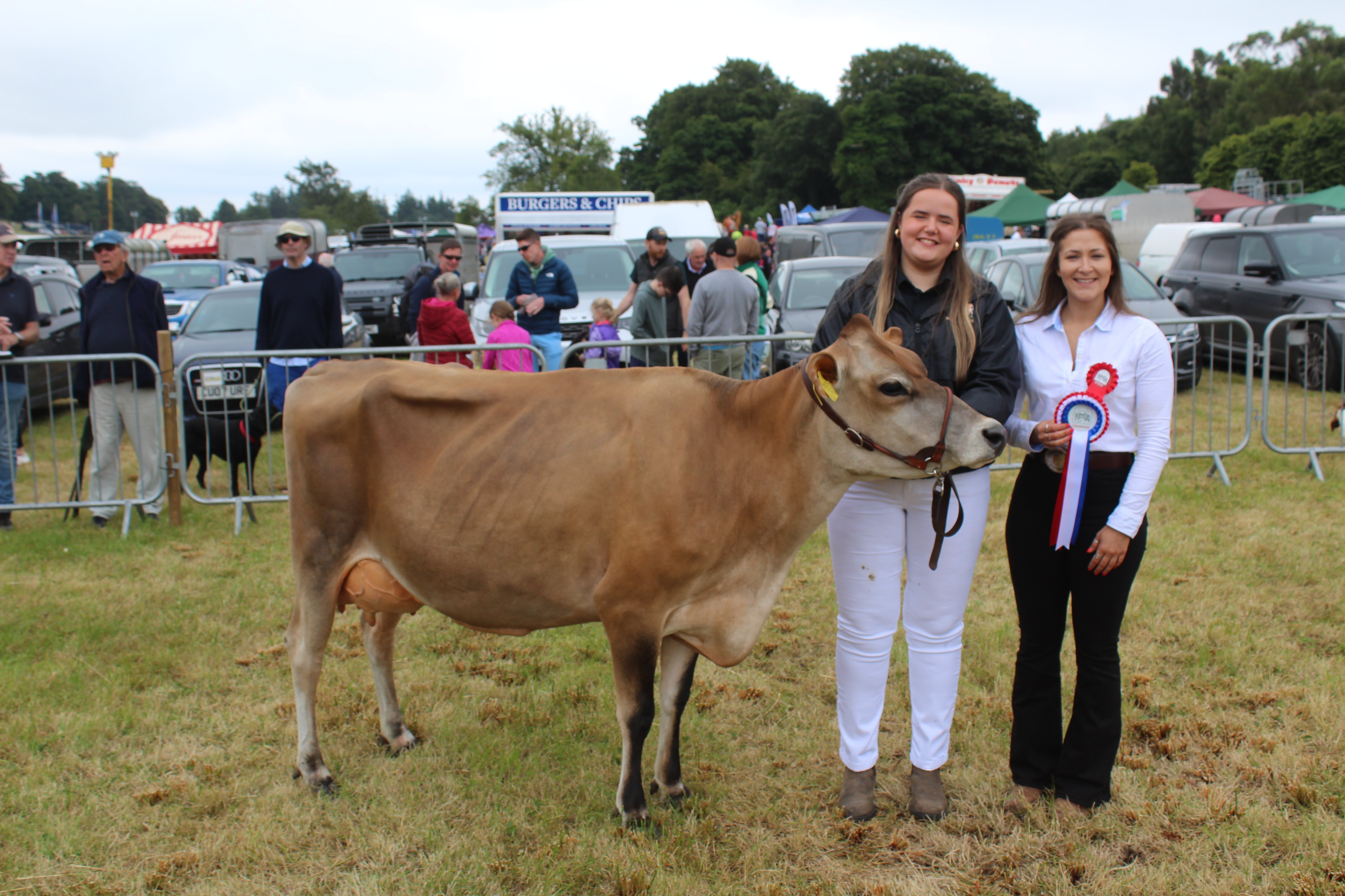 The dairy inter-breed champion at Castlewellan Show 2024 with exhibitor, Ailsa Fleming and judge Jessica Hall