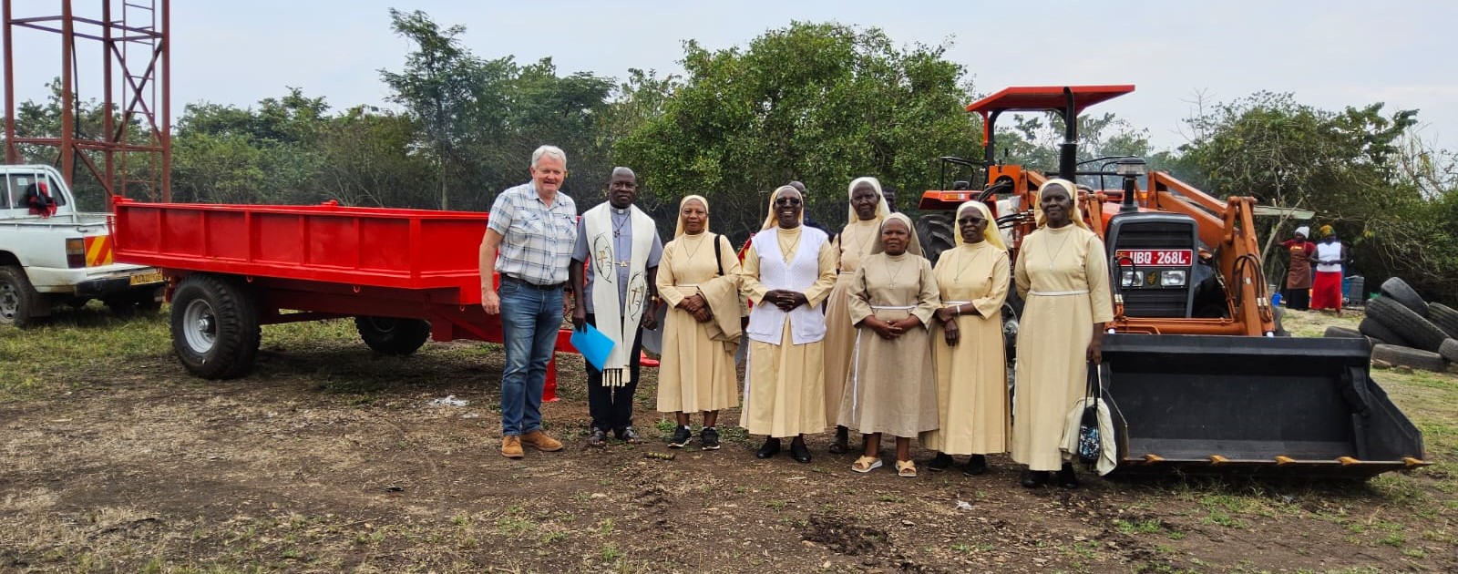 Maguire with some of the Little Sisters of St Francis community, handing over the farm machinery Source: MD Media