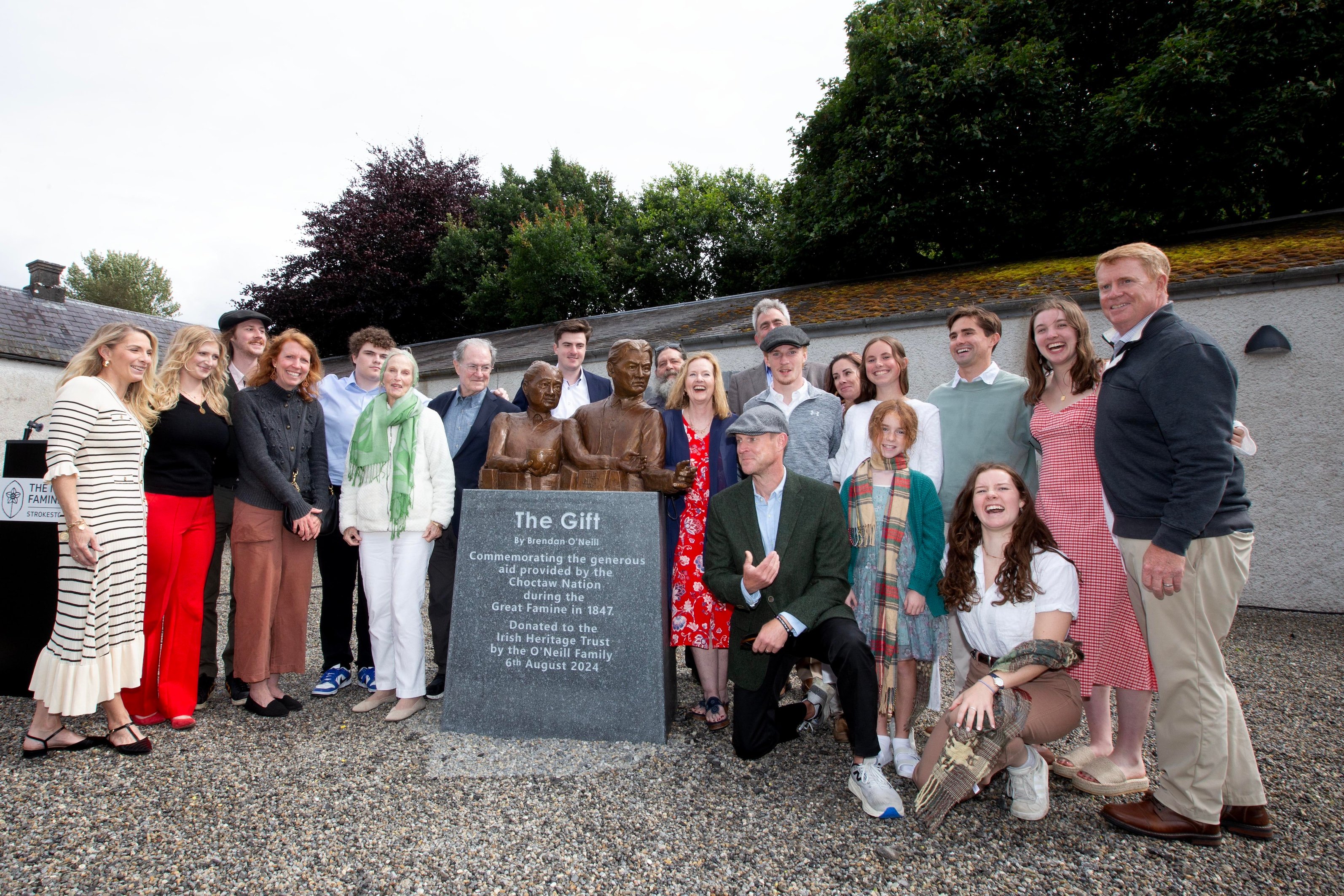 Sculptor Brendan O'Neill and his wife Susan after the unveiling with their children, grandchildren and extended family who travelled from the U.S. for the unveilingImage source: Brian Farrell