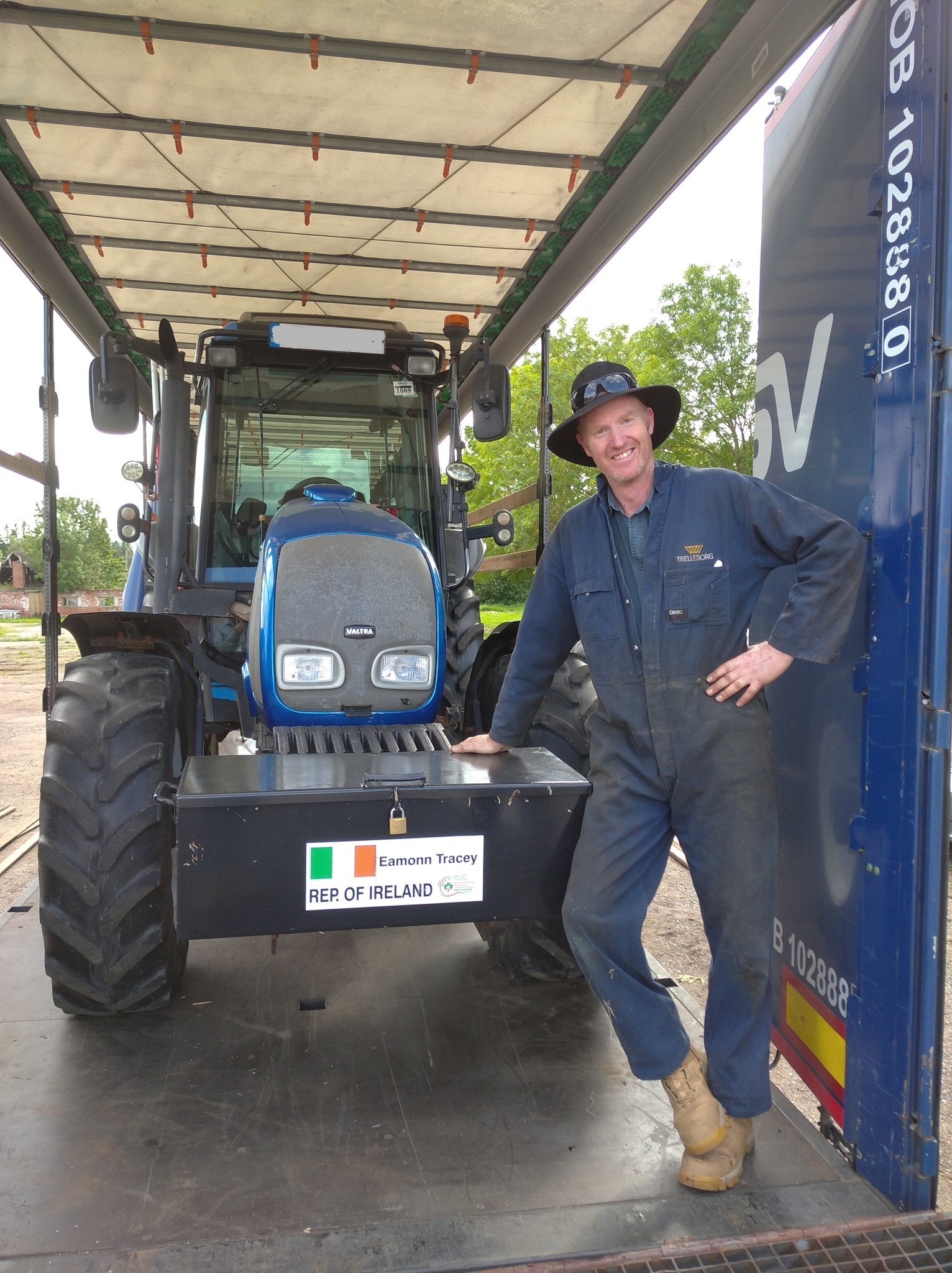 A member of Australia's team about to drive Eamonn Tracey's Valtra off the lorry Source: World Ploughing Championship 2024