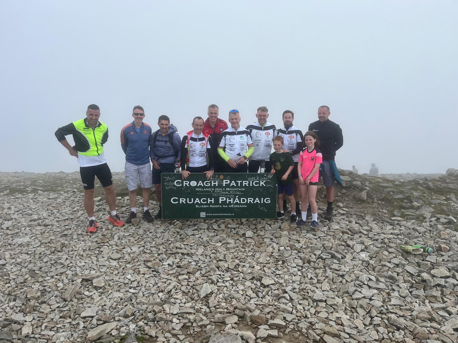 Cyclists pictured at the top of Croagh Patrick. Image source: Alan Heaney