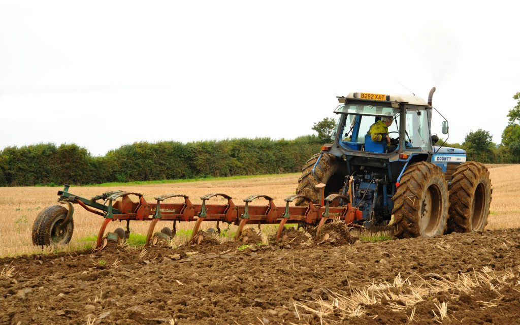 The advantage of equal sized wheels is ably demonstrated by this 120hp  County 1184 happily pulling a six furrow  plough