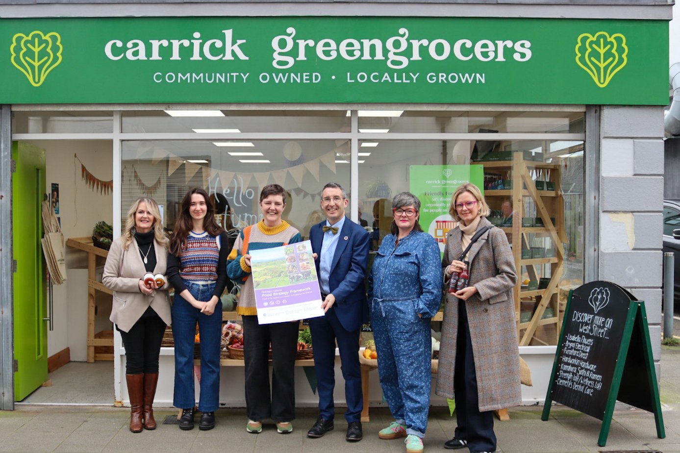 DAERA Minister Andrew Muir with directors and suppliers of Carrick Greengrocers where he launched the Northern Ireland Food Strategy